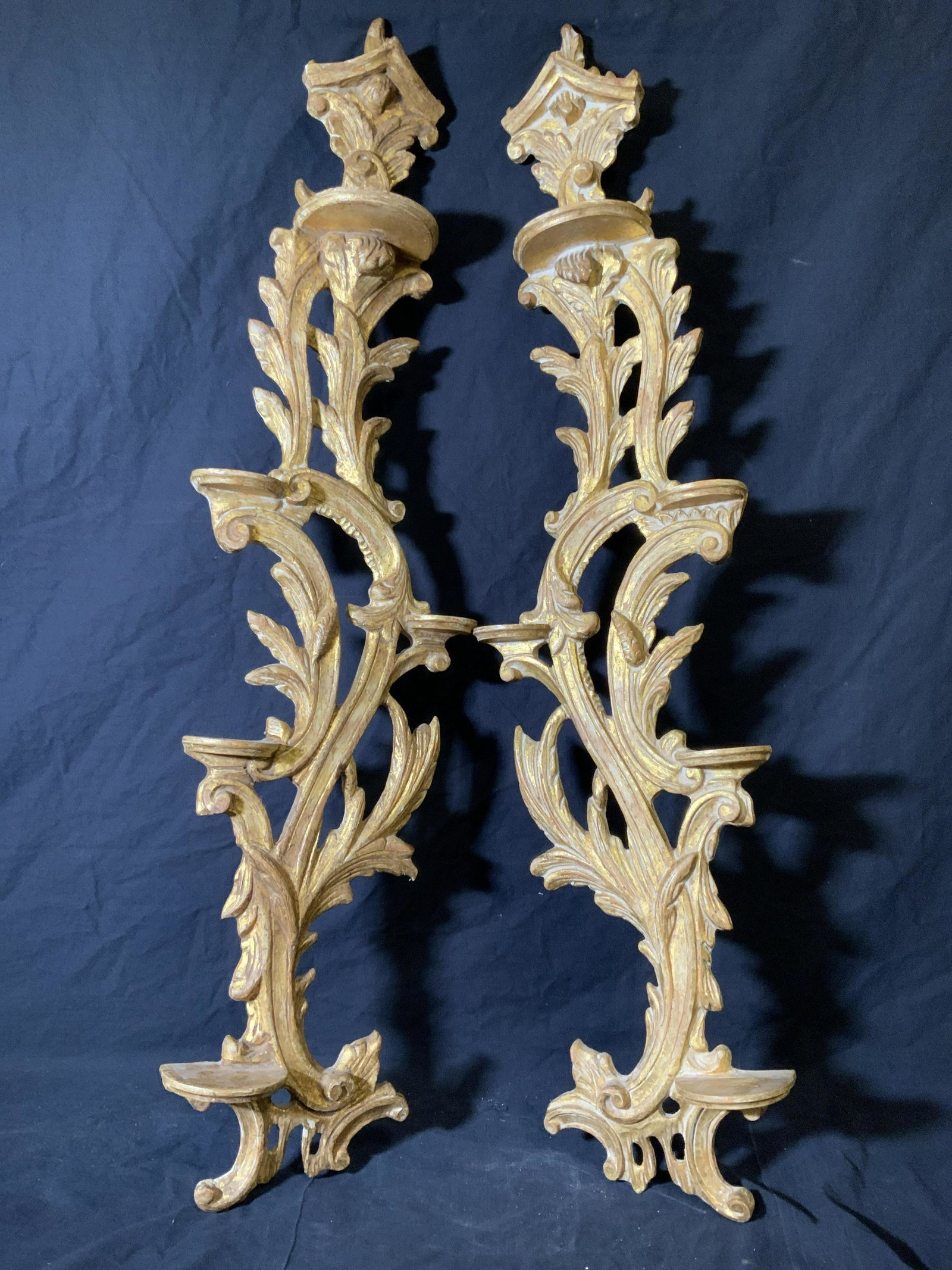 Grande Pair Antique Gilded Wood Wall Sconces: Grande pair antique gilded wood wall sconces, no apparent inscriptions or markings, subject a pair of hand carved gold leaf wall sconces with 5 platforms each for possibly candles or figurines, piece 
