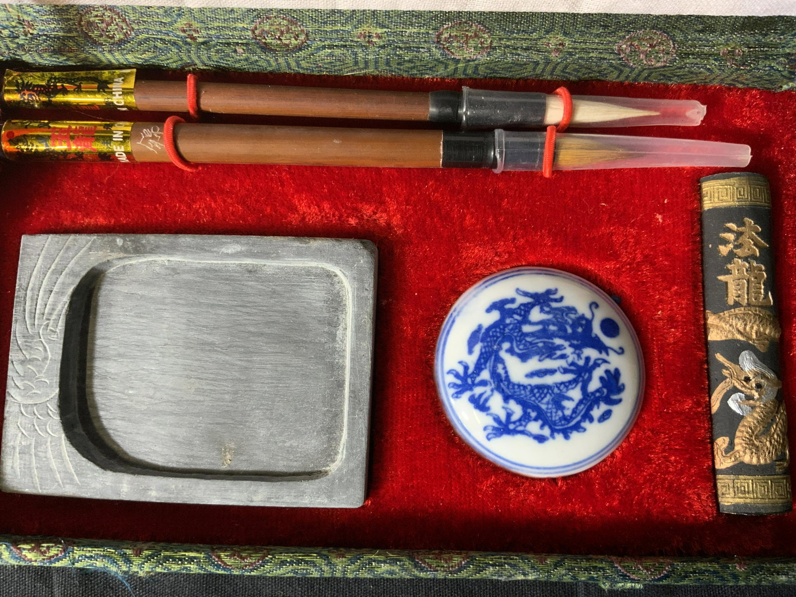 Chinese Calligraphy Set: Chinese Calligraphy Set, inscriptions to piece in Chinese characters, comes with ink stone, ink, and brushes, measures 1 1/8 x 6 3/4 inches at widest point, in good condition, never used, Property of 
