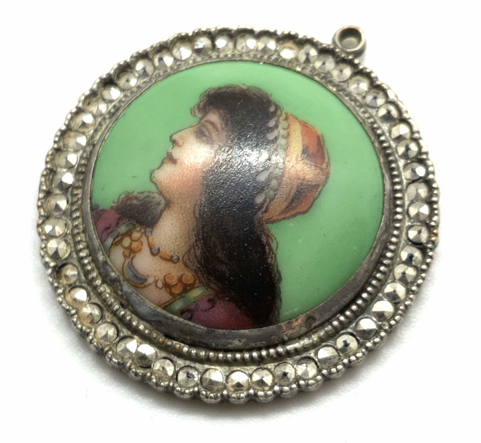 Vintage Painted Female Portrait Pendant, Jewelry: Vintage, possibly antique, necklace pendant. Center is a composite material that has the painted side profile of a woman on it. Victorian style. Rhinestones surround the bezel set center painting. Etc