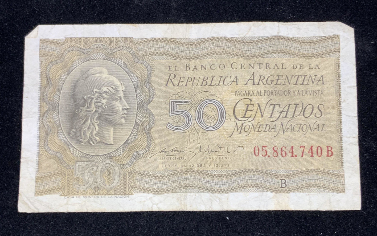 Vintage Republic Argentina Currency, 50 Centavos: A vintage Republic Argentina Banknote. Front depicts Liberty (Progreso) head in profile wearing a Phrygian cap. Reverse: Open book of the National Contitution. Predominant colors are brown and green. 