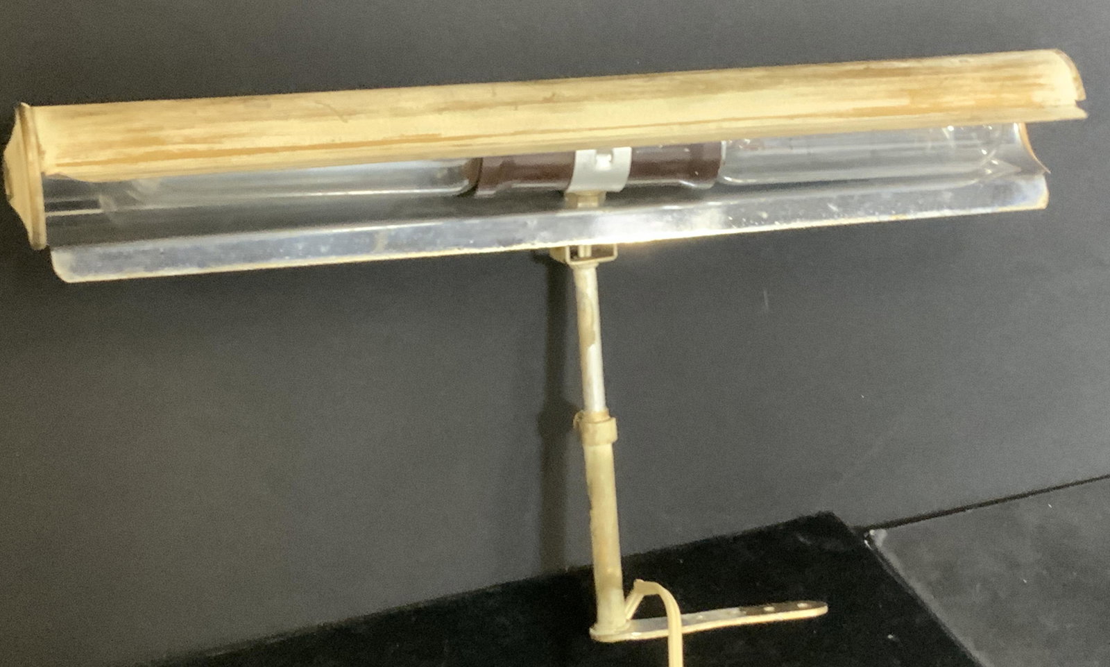 Vintage Frame Lamp or Library Furniture Light: Vintage light, mounts to art frame, wall or cabinet . One bulb working condition. Switch on/ off attached plug. wiring attached. 14 in. Long. Brass metal with painted wash. Art frame lamp, library lam