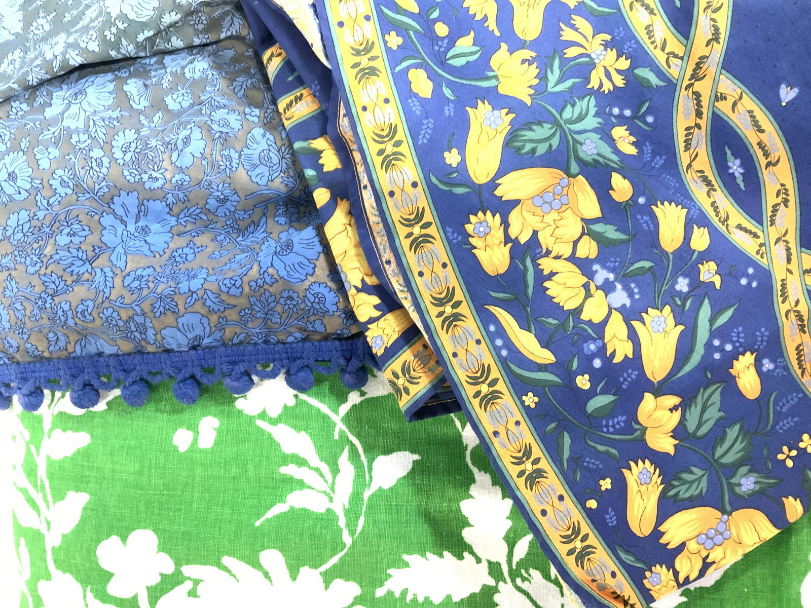 Lot3 Vintage Collectible Tablecloths, FR Country: Country Country Intake Heavy cotton mid century floral green and white tablecloth. App 48 x 80 in. Vintage blue tabletop cover with ball fringe piping. Discoloration on parts of fabric but can up cycl