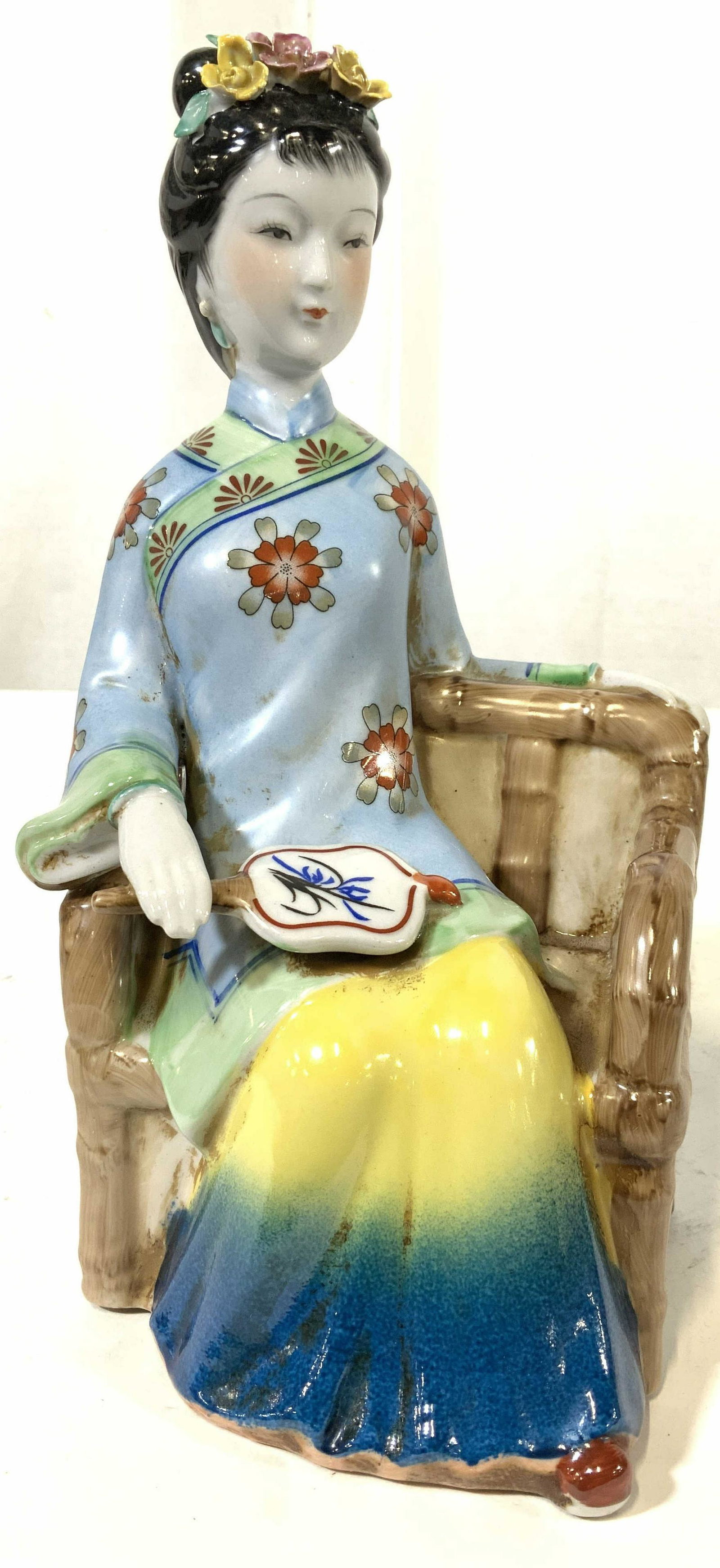 Vintage Asian Ceramic Seated Female Figural: Asian ceramic, Asian porcelain seated female figural in festive attire, floral hair adornments, and fan, chinoiserie, made in China on underside, orientalism, orientalia, figural, statue, decorative a