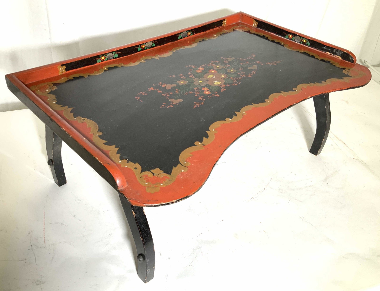 Hand Painted Asian Lacquer Tray Table: Foldable legs to break fast tray, hand painted red black gold design, floral center, black wood lacquer paint, Asian decorative arts, tray table, home accessory, measures app 24 by 15 inches, 9 inches