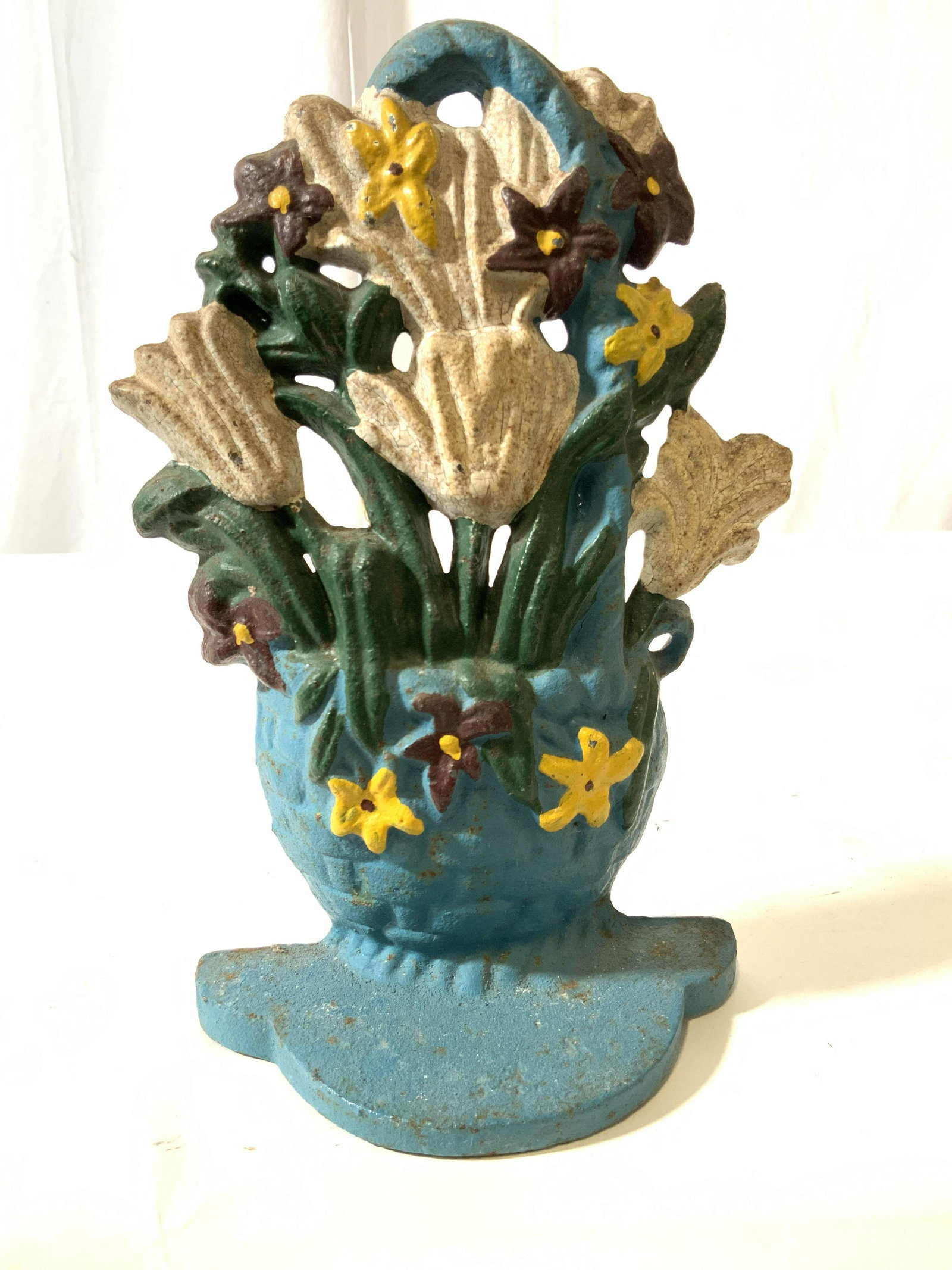 Vintage Flower Basket Iron Doorstop: Vintage possibly antique iron doorstop, cast iron Figural of woven basket with handle tulips and floral bouquet, collectible, decorative arts, collectible, home accent, measures ht app 9.5 inches widt