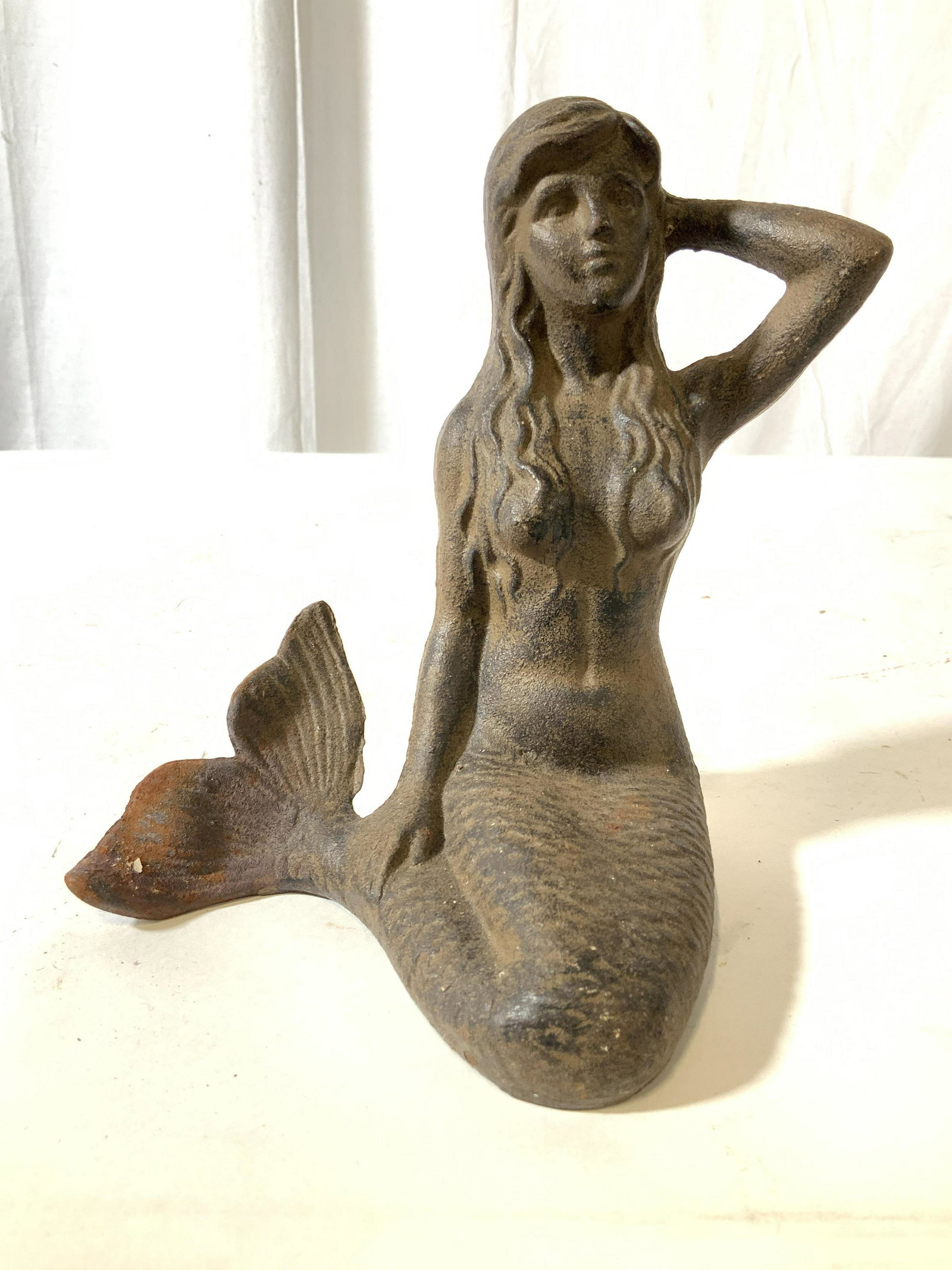 Antique Cast Iron Mermaid Figural: Garden statuary, collectible, door stop, garden ornament, cast iron Figural seated mermaid measures ht 8 inches width 8 inches, mermaid, nautical, measures ht 8 inches width 8 inches depth app 5 inche