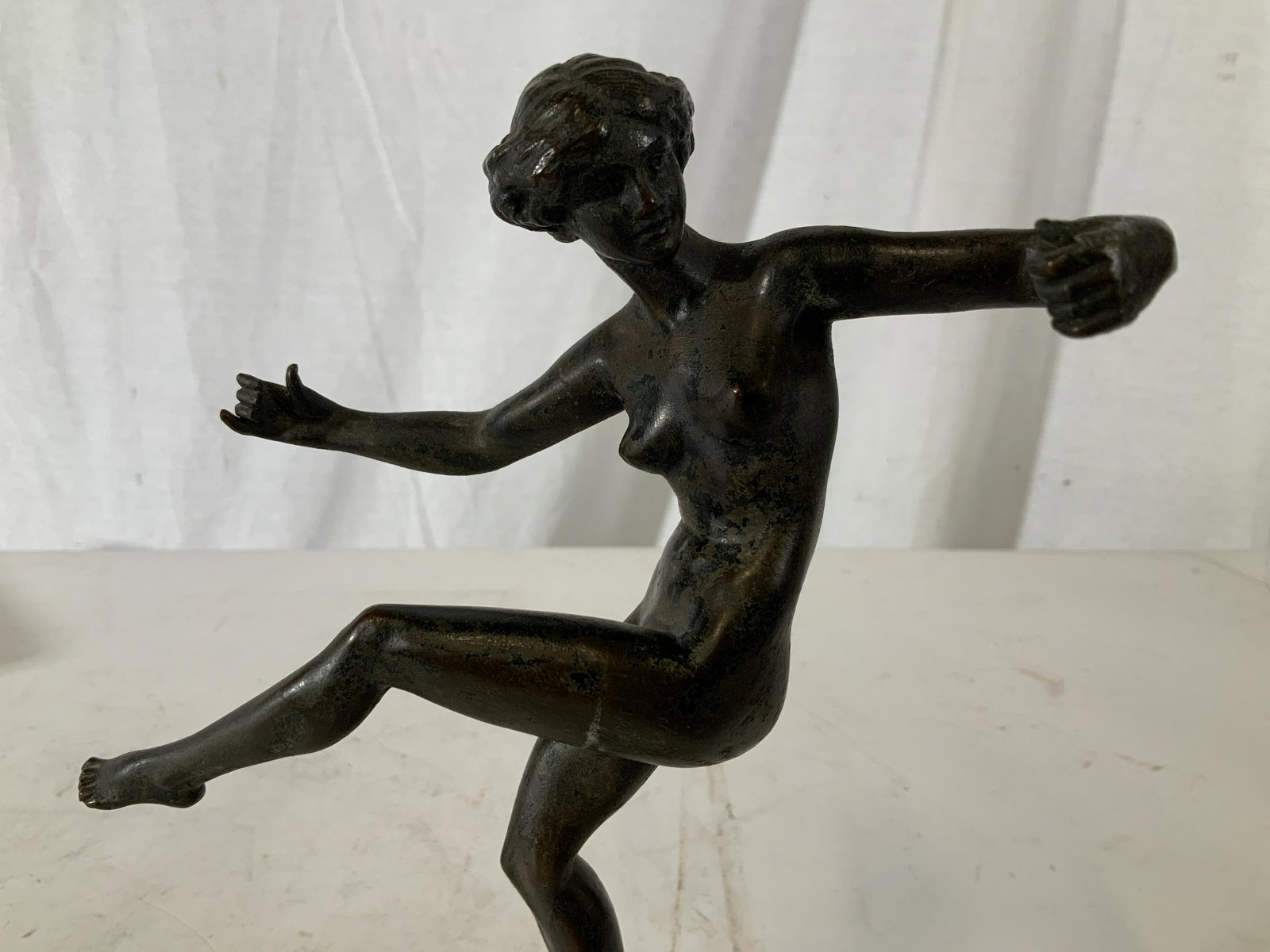 BRIAN Signed Female Nude Bronze Sculpture: BRIAN Signed Female Nude Bronze Sculpture with composite base, signature reads ‘Brian’, subject a dancing woman, measures 8 3/4 inches x 6 inches at widest point, some tarnishing and wear to patin
