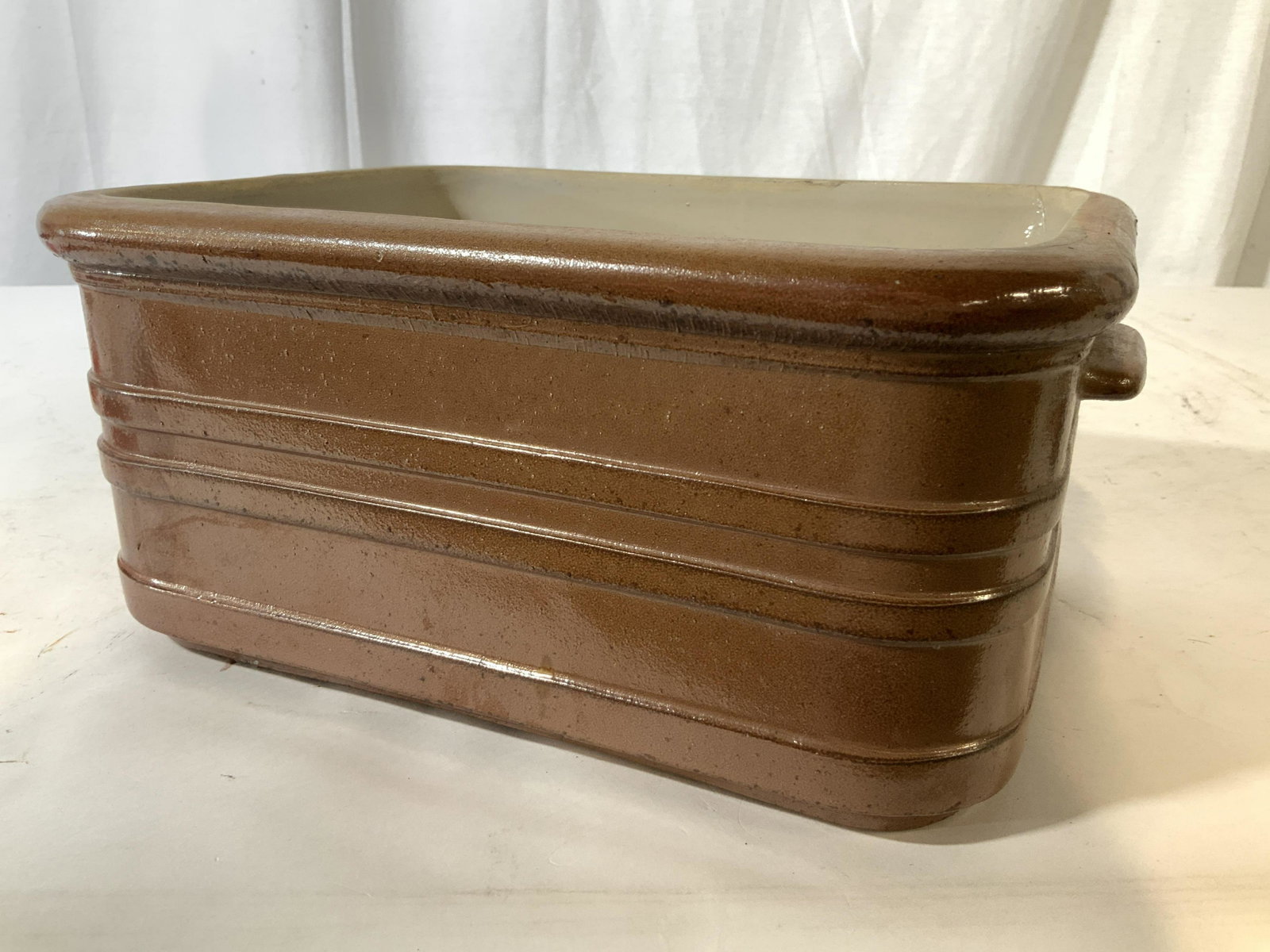 Glazed Ceramic Tableware Cookware: Heavy ceramic, thick walled glazed in maple and cream tones, kitchen ware, vessel, tableware, tabletop accessories, measures ht 5.5 inches 12.5 by 9 inches, property of Janine Metz Estate, social secr