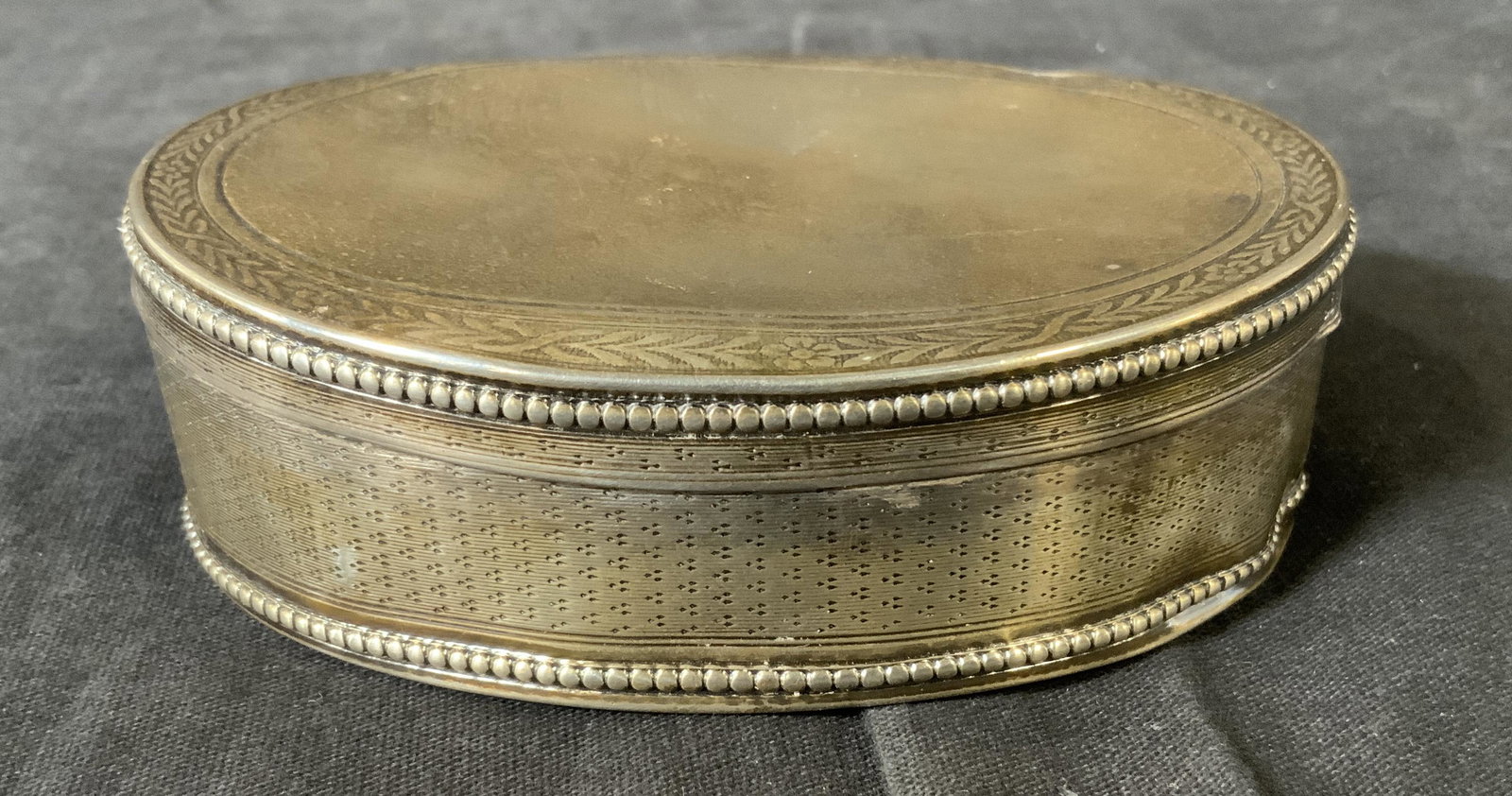 Antique Marked Sterling Silver Trinket Box: Antique Marked Sterling Silver Trinket Box, diamond shaped mark to lid, measures 1 3/8 inches tall x 4 inches at widest point, weight: 2,80 ozt, some dents and surface wear to metal,pill box, trinket 