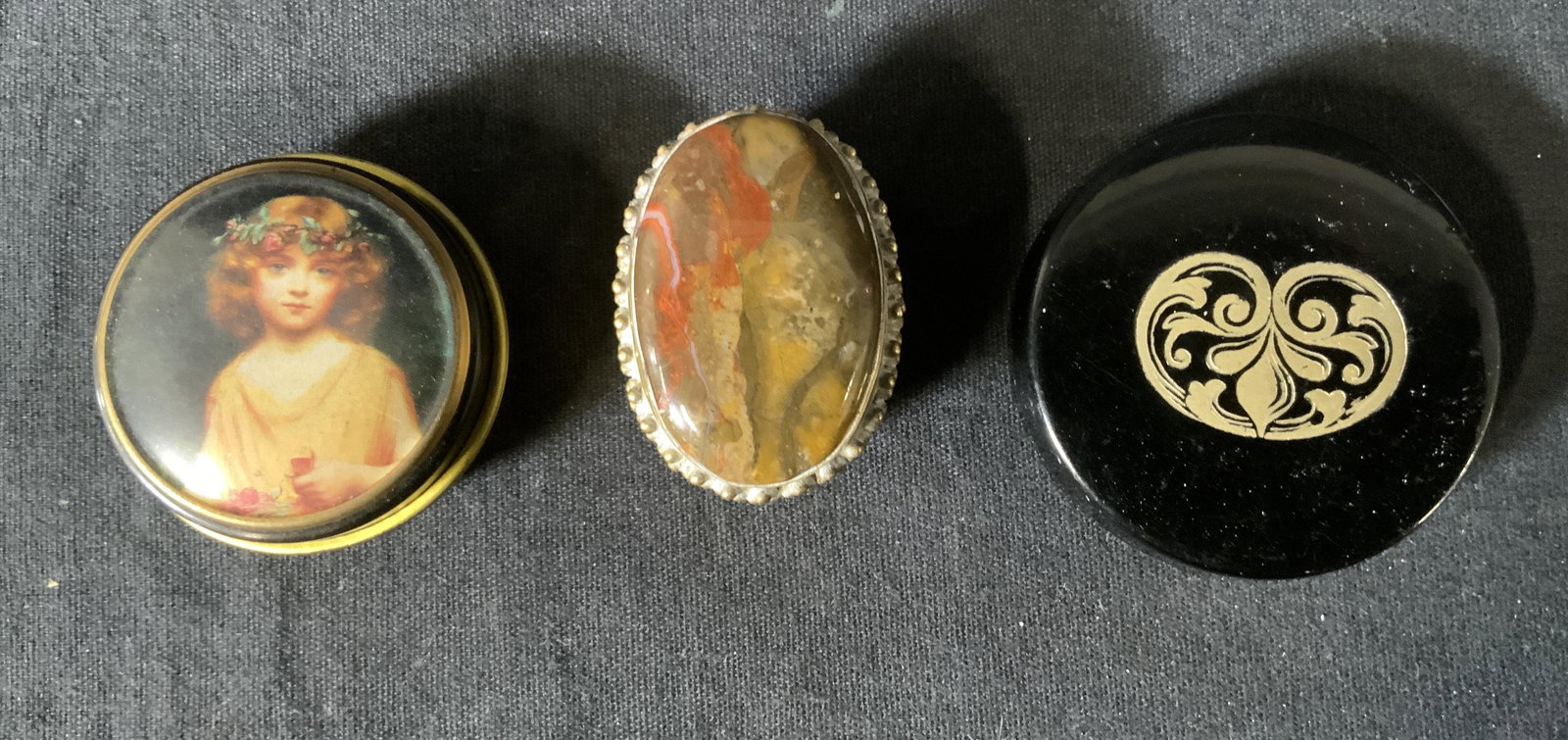 Lot 3 Mixed Media Pill Boxes, Brass & Agate & more: Lot 3 Vintage Mixed Media Pill Boxes, inscriptions read ‘Made in France’ and ‘Bentleys’, smallest measures 5/8 x 1 5/8 inches in diameter, largest measures 1/2 x 2 inches in diameter, some sur