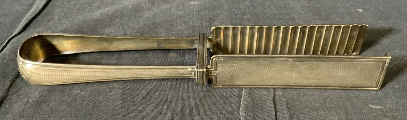 Vintage CHRISTOFLE Silver Plated Asparagus Tongs: Vintage CHRISTOFLE Silver Plated Asparagus Tongs, c 1935, inscription to piece reads ‘Christofle’, measure 10 7/8 x 2 inches at widest point, some tarnishing and surface surface wear to piece, Pro