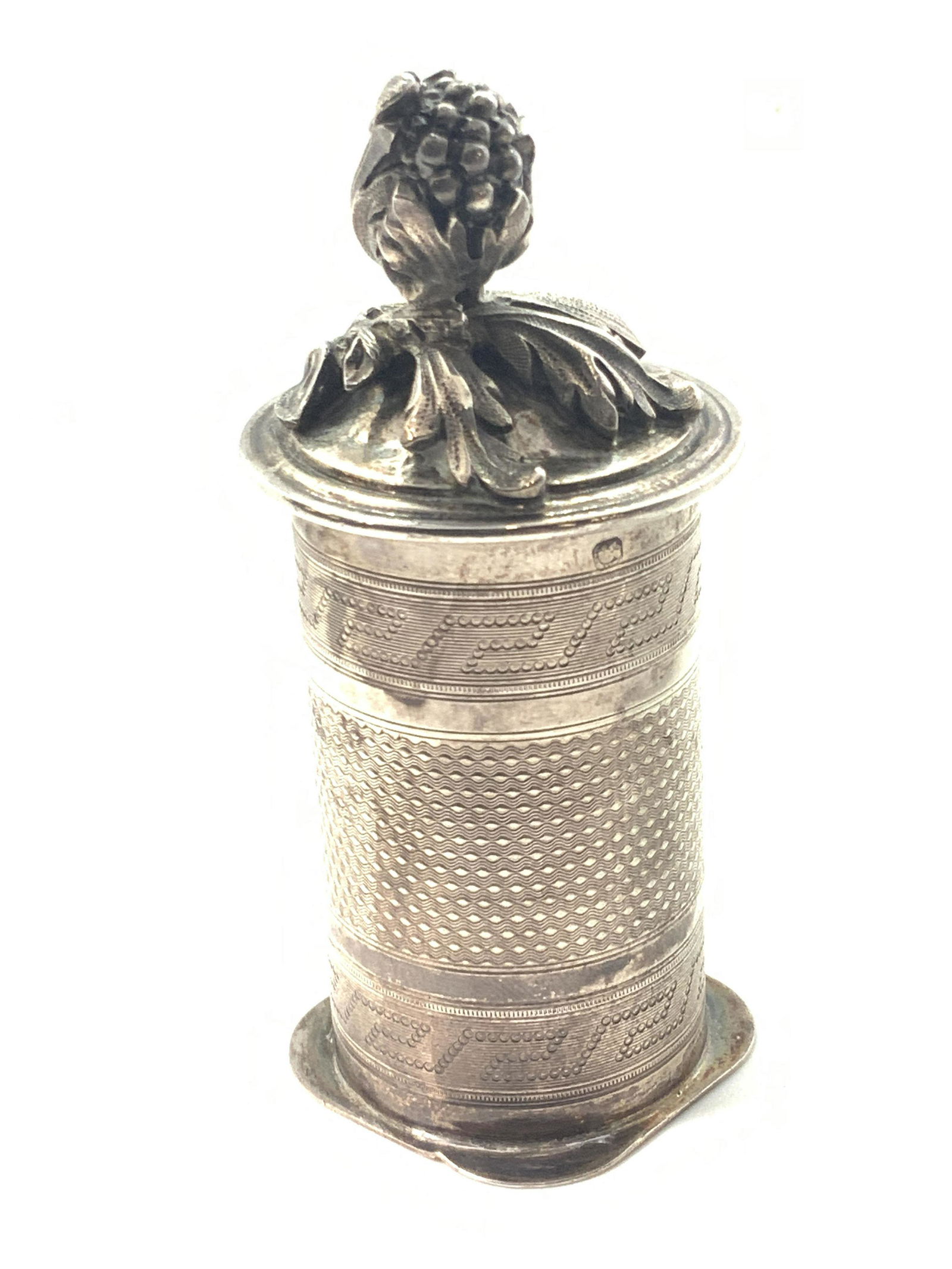 Antq French Sterling Silver Lidded Nutmeg Grinder: An antique sterling silver nutmeg grinder / grater. This piece features detailed and and embossed metalwork along all surfaces, sides, top & underside. Lid has an embossed and etched floral, possibly