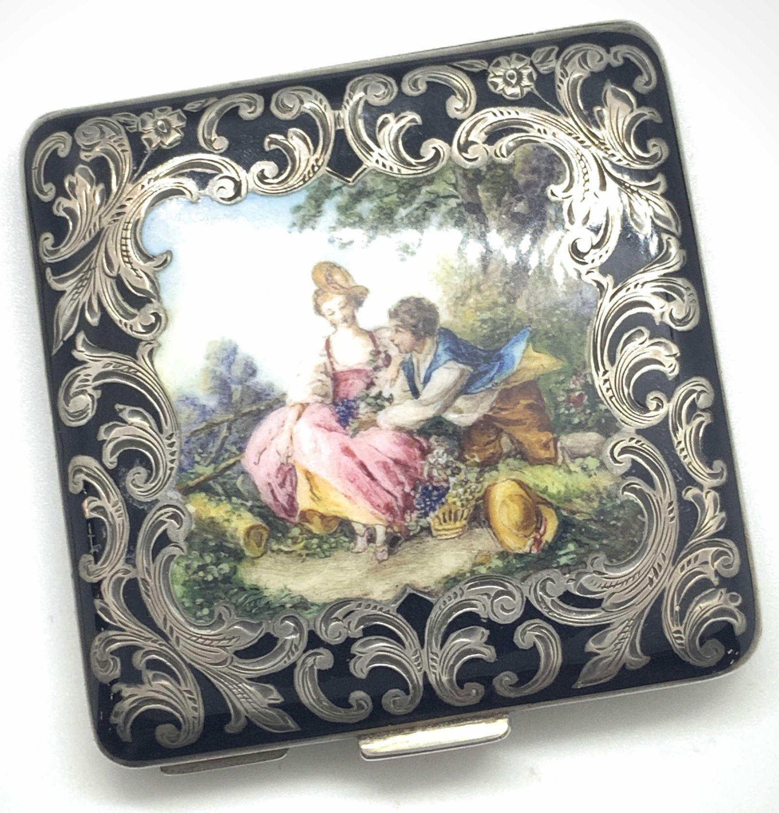 Vntg Hand Painted Austrian Sterling Silver Compact: A vintage, possibly antique, sterling silver Austrian enameled compact. This piece was once used for storing makeup. Precise hand painted, enamel, and hand etched designs along the from. The underside