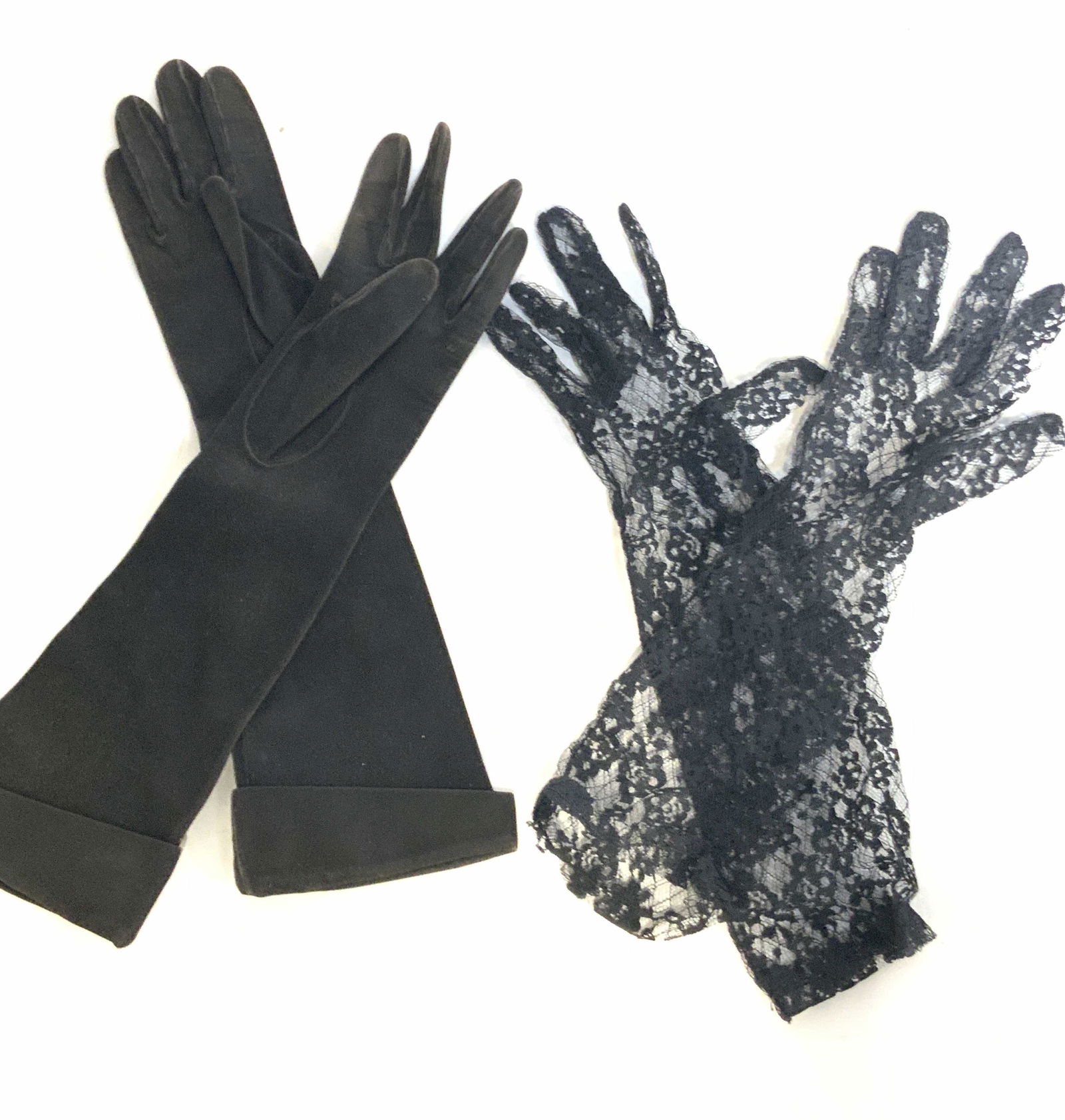 Lot 2 KID SUEDE & More Suede & Lace Ladies Gloves: Two pairs of long ladies fashion gloves. The long deep brown suede gloves are signed: KID SUEDE. SAKS FIFTH AVE. MADE IN FRANCE. They are marked as being size: 6 1/2. They also possess a black seed be
