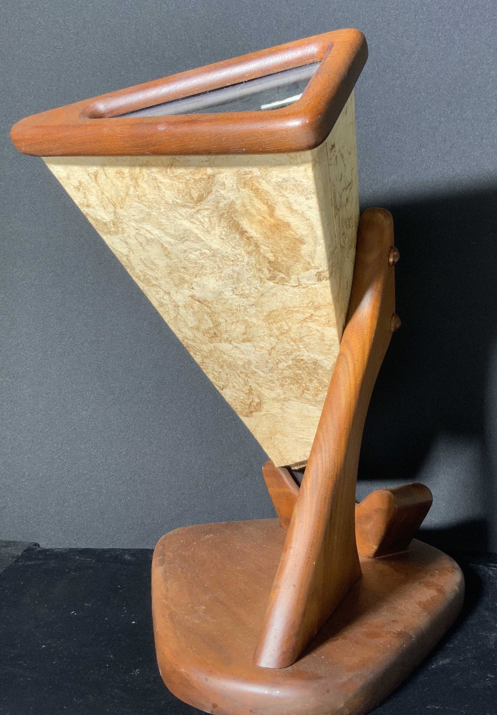 Mid Century Modern Wooden Sculptural Kaleidoscope: An oversized kaleidoscope sculpture crafted from wood, glass, and composite material. Possibly teak wood. The kaleidoscope is mounted to a wooden base stand. The piece is functional. If you gaze into 