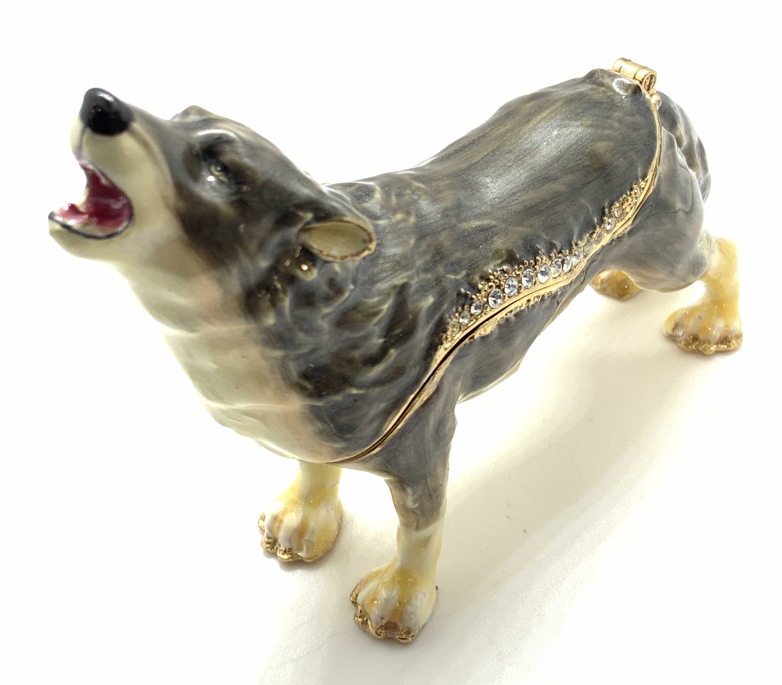 NOBILITY Enamel Wolf Trinket Box, Original Box: A Nobility Brand trinket box in the form of a howling wolf. This piece comes with it’s original box that reads NOBILITY across all sides. The box contains a pink toned fitted satin interior. The wol