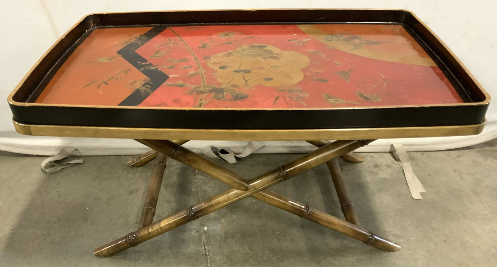 Red & Black Lacquer Asian Tray W Bamboo Base: Asian tray sits on top of bamboo base. Tray is red and black with intricately painted scene with birds, flowers, vine and leaves. Piece appears to possibly be vintage. Piece measures approx 20 inches 