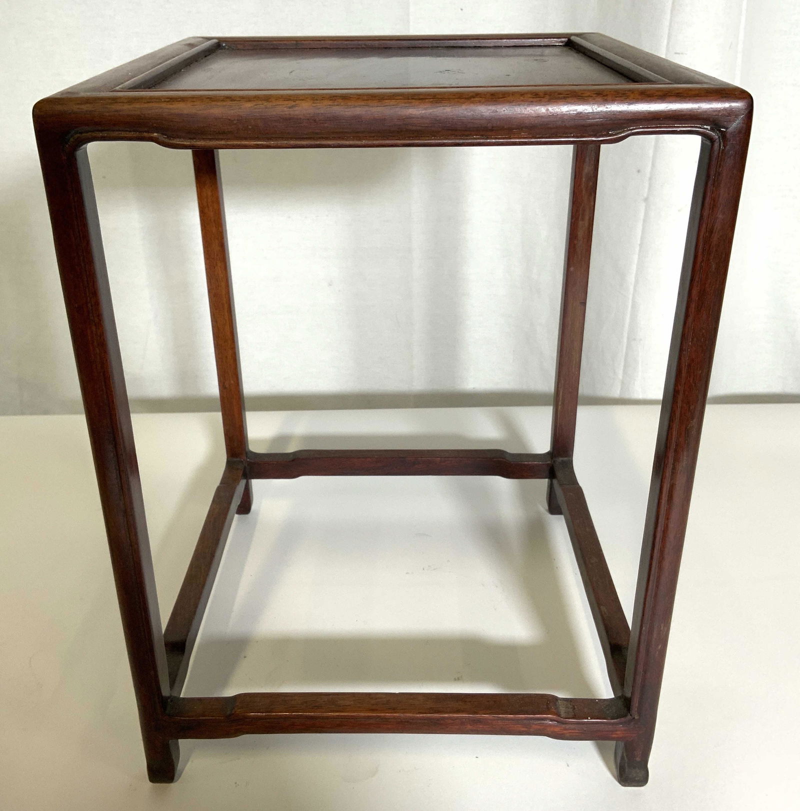 Vintage Asian Wooden Nesting Table: Table is vintage & wooden possibly antique. Table is brown toned. Contains 4 legs with square shaped stretcher in between. Piece measures approx 12 inches tall 9 inches wide & deep. Vintage table, Asi