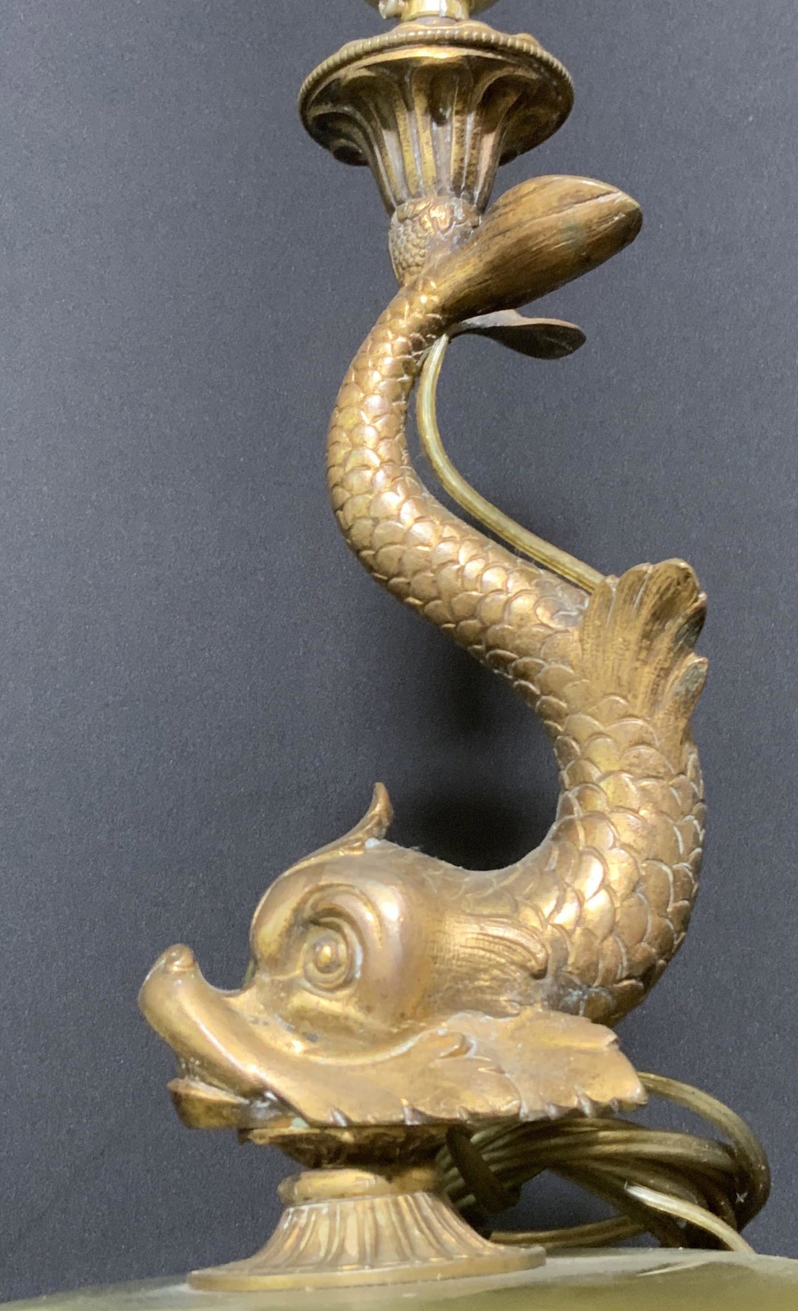Vntg Asian Natural Stone & Brass Koi Table Lamp: A vintage lamp depicting an intricately etched brass koi fish figural. Below the fish, the base of the lamp has a polished green natural stone, possibly jade, set upon metal. The stone has natural whi