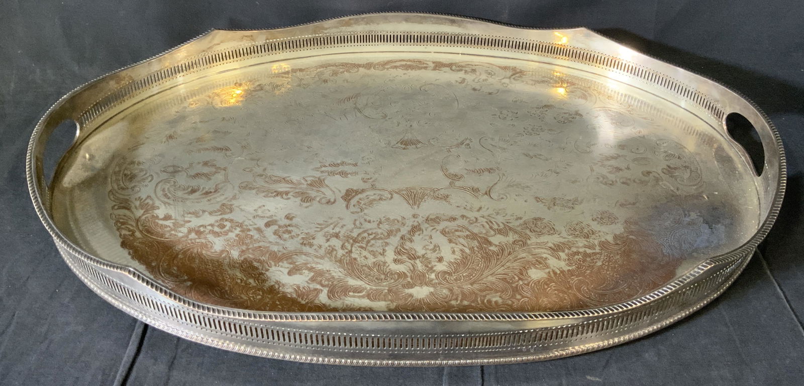 SHEFFIELD Signed Silver Plated Serving Vanity Tray: SHEFFIELD Silver Plated Serving Tray, inscription reads ‘Made in Sheffield England 0’, measures 2 3/8 inches tall x 23 3/4 inches at widest point, some surface wear and tarnishing to piece, Sheffi