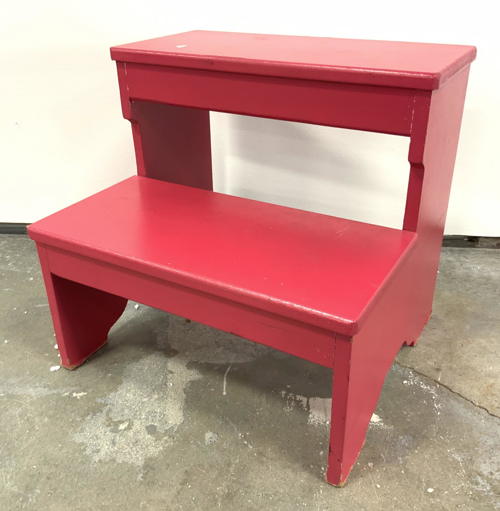 Vintage Red Wooden Step Stool: Step stool is vintage possibly antique. Piece is wooden. Stool has 2 steps. Painted vibrant red. Piece measures approx 12 inches tall 13 inches wide 12 inches deep. Step stool, vintage step stool, woo