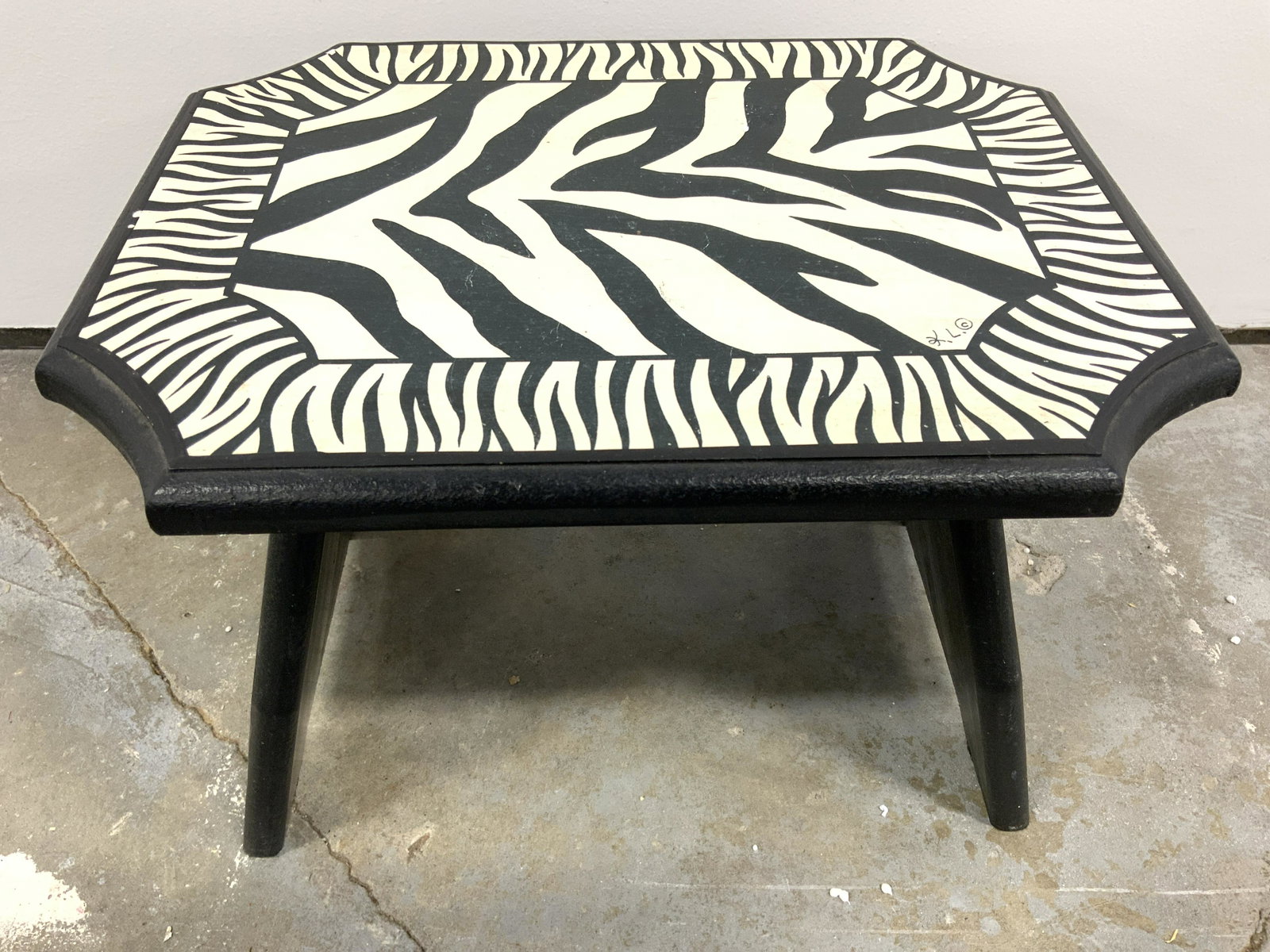 Vintage Wooden Zebra Print Footstool: Footstool is vintage. Piece has zebra print style detail. Foot stool is wooden. Piece measures approx 14 inches long 10 deep tall inches tall. Footstool, wooden foot stool, zebra print foot stool, vin