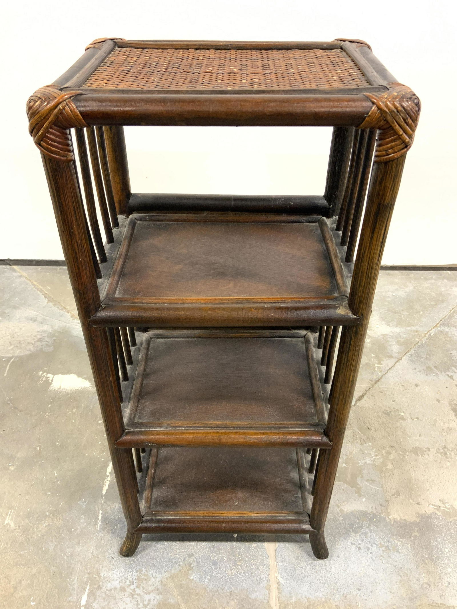 Vintage Caned Top Shelved Wooden Side Table: Side table is vintage possibly antique. Piece has caned tabletop & 3 wooden shelves. Piece has feet which flare outwards. Piece measures approx 22 inches tall 10 inches wide 8 inches deep. Vintage can