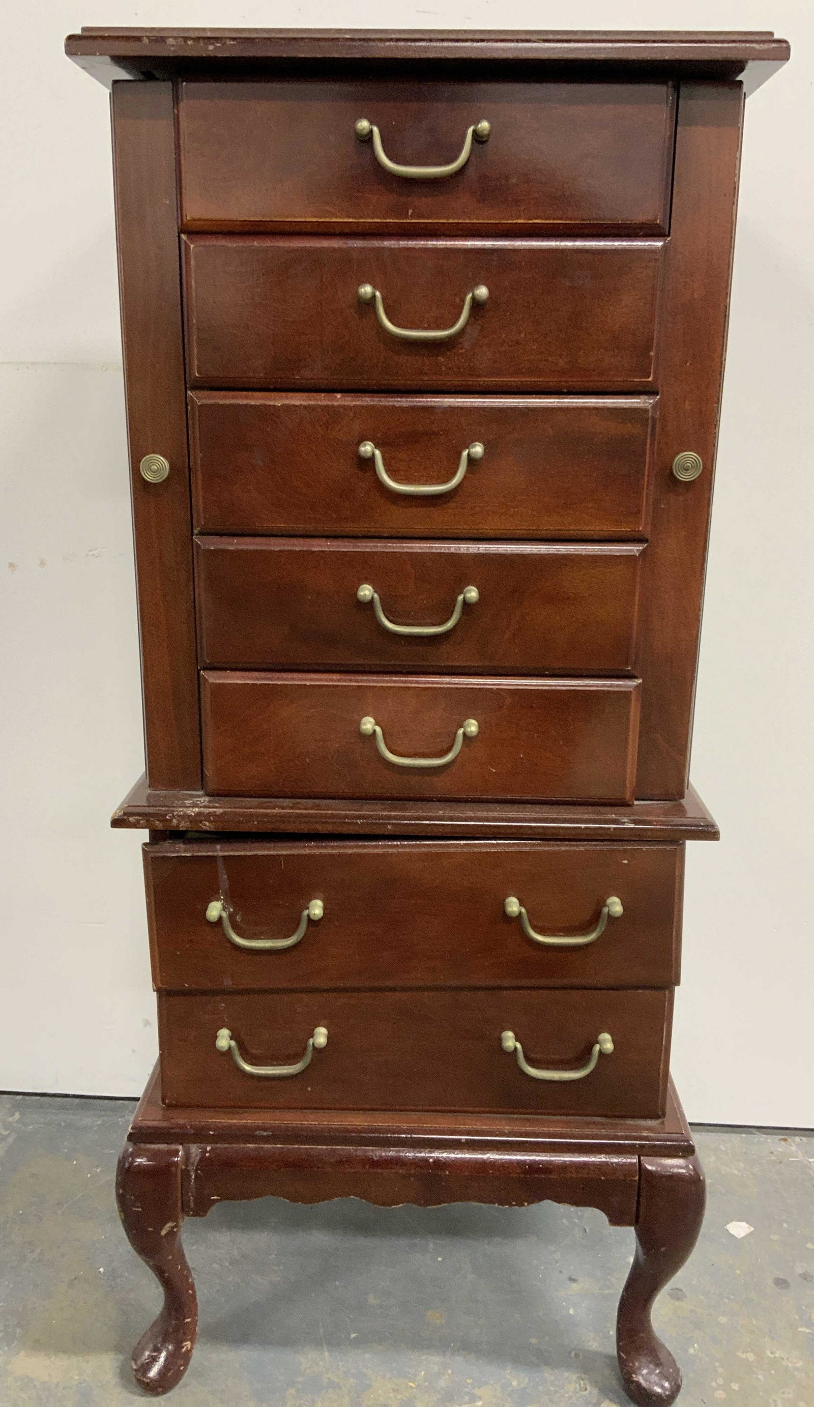 Vintage MELE Wooden Jewelry Box W Mirror: Vintage wooden jewelry box. 6 drawers, each with a brass drawer pull, top of box opens to reveal a mirror and additional compartment. Each side of the box is a compartment for necklace storage. Each c