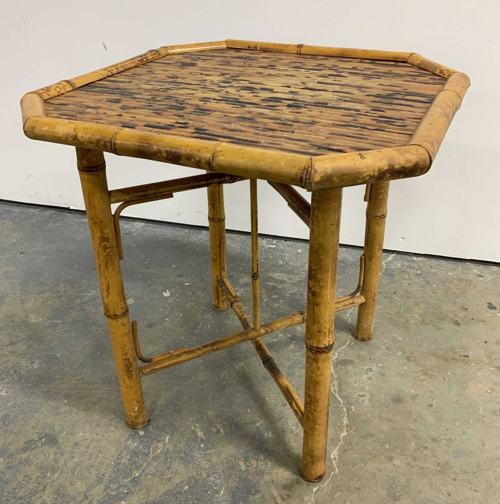 Vintage Bamboo Side Table: Vintage octagonal side table, crafted from bamboo. Possibly Handmade. Legs can be detached from table top, legs fold for storage purposes, once removed. Measures approx 18.75 inches H, 18.25 inches W,