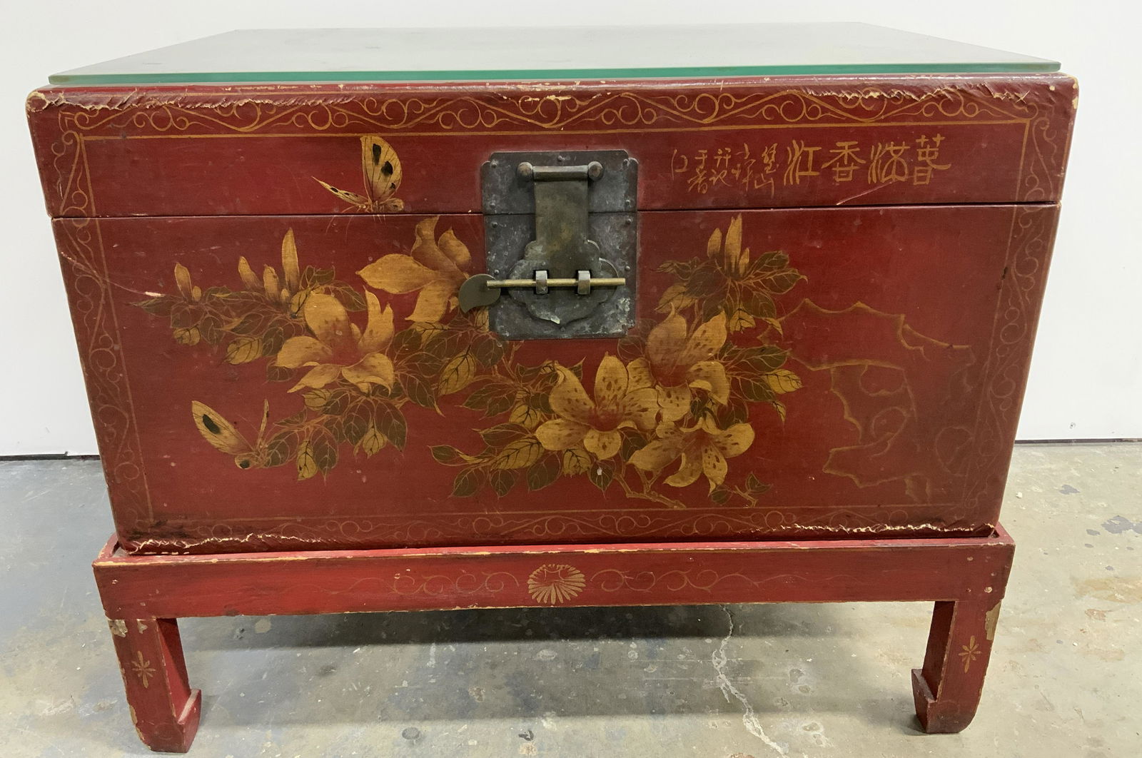 Antique Asian Trunk Side Table: Antique Asian side table, converted from a trunk. Trunk is hand painted and depicts butterflies, flowers, and birds. Hand painted detailing in gilt paint decorates borders of trunk. Asian characters a