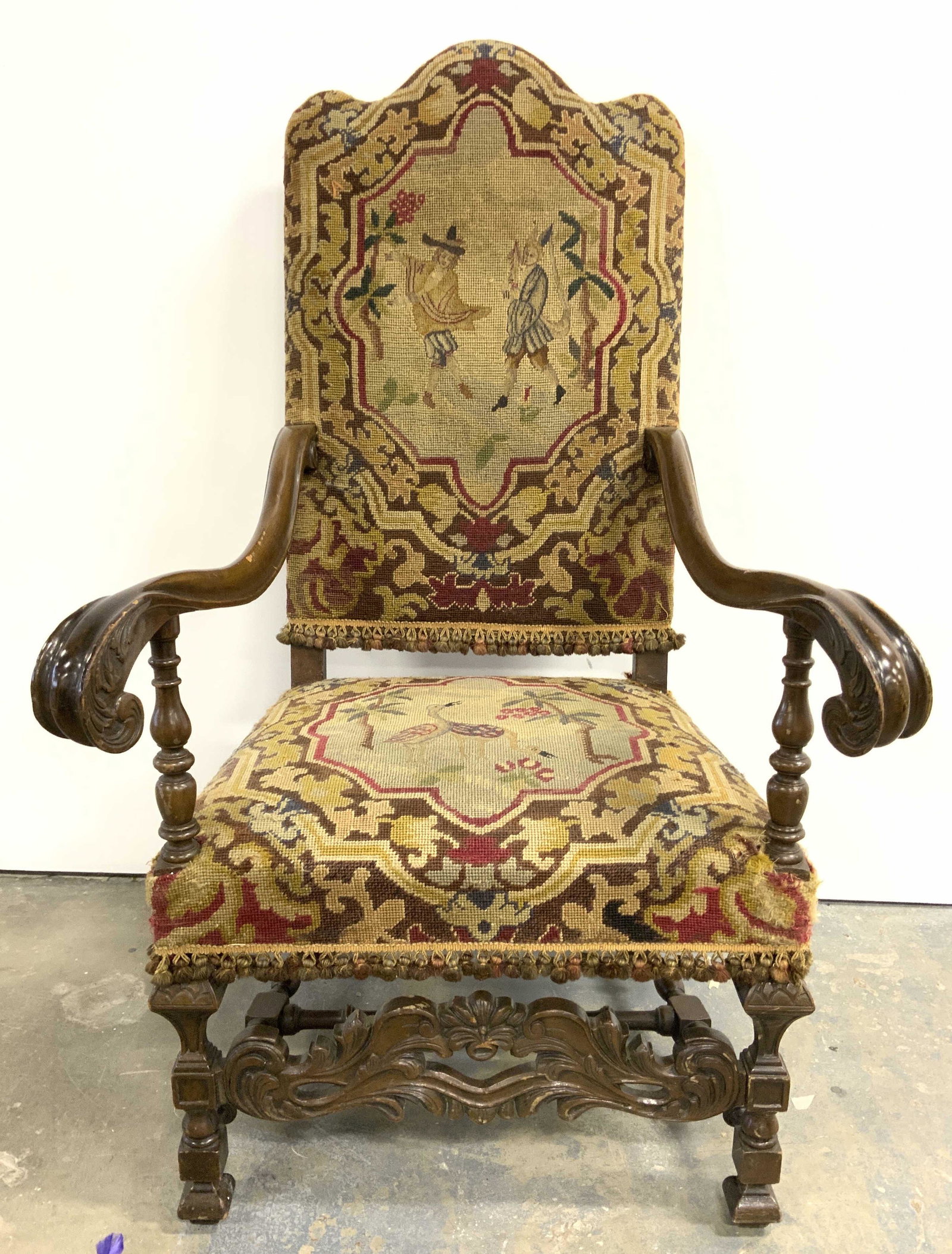 Antique Needlepoint Upholstered Wooden End Chair: End Chair is vintage possibly antique. Piece has intricate needlepoint detail with floral & leaf detail in addition to depiction of figurals birds & trees. Piece also has intricately carved armrests, 