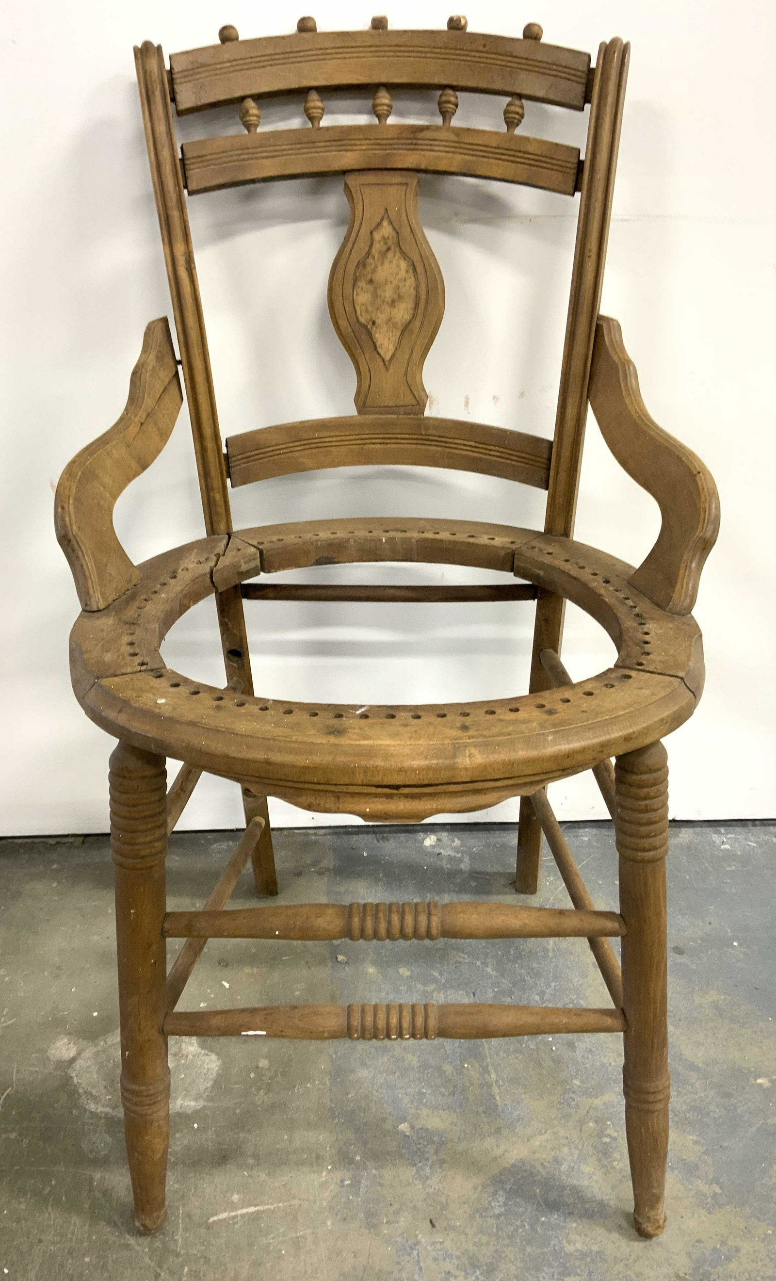Vintage Carved Wooden Chair Frame: Chair frame is vintage & wooden possibly antique. Chair is beige toned. Contains 4 legs with double stretchers in between. Piece measures approx 33 inches tall 20 inches wide & deep. Chair, chair fram