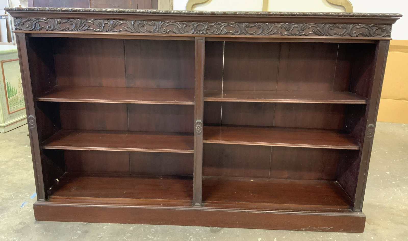 EDWARDS & ROBERTS Wooden Display Book Shelves: Carved Wooden display shelves. Includes four adjustable Shelves. Carved detail along trim, medallions carved into shelves resemble flowers. Measures approx 38.5 inches H, 61.5 inches W, and 13.25 inch