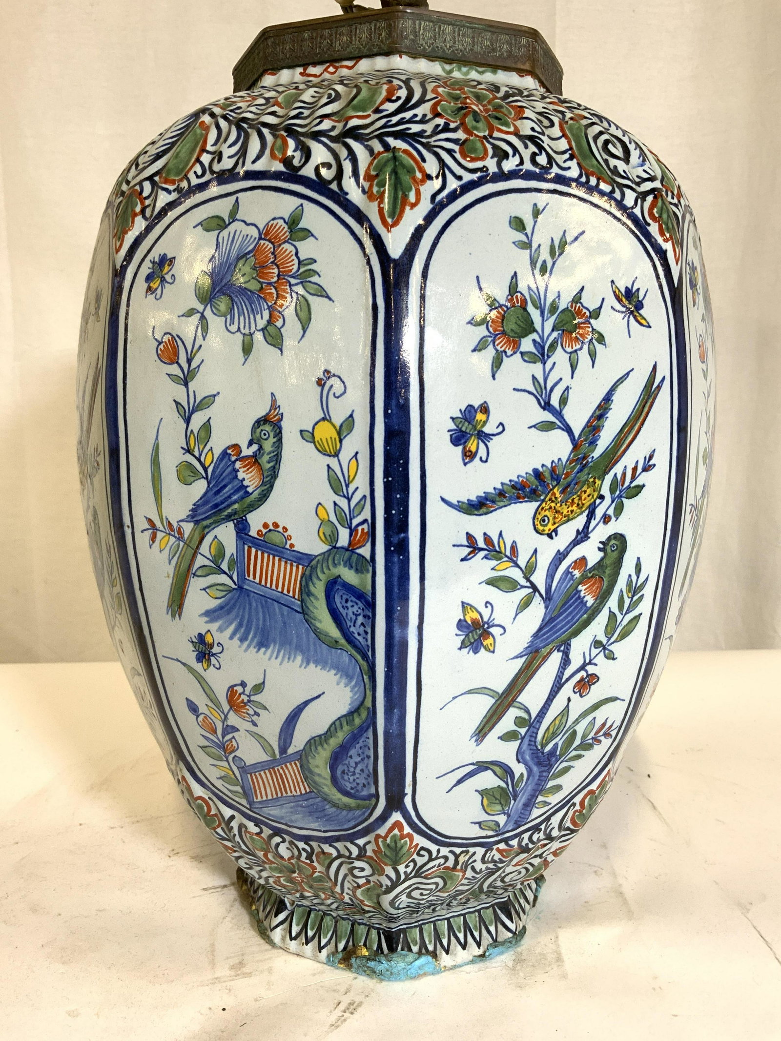 Vintage Hand Painted Asian Porcelain Lamp: Lamp is vintage possibly antique. Piece appears to have hand painted elements. Lamp has intricate multi toned floral vine, leaf, butterfly & bird detail. Lamp includes harp & finial. Piece measures ap