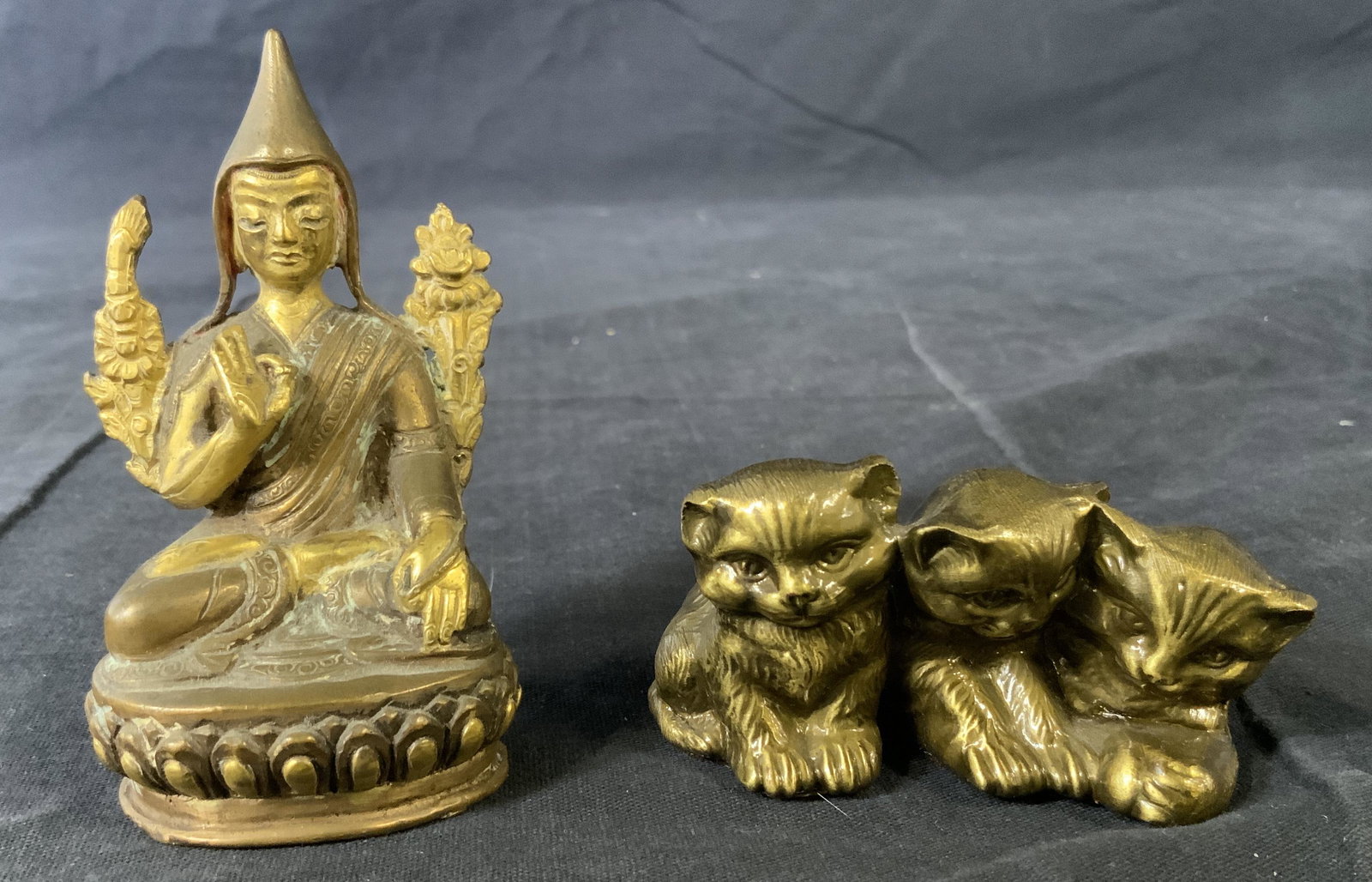 Lot 2 Brass Figurines, Kittens & Buddhist Figure: Lot 2 Brass Figurines, Kittens & Buddhist Figure, label to base of kitten figurine reads ‘ PM Craftsman Hand Craftsmanship The Mark of American Quality Eaton Park Florida’, measures 1 1/2 x 2 5/8 