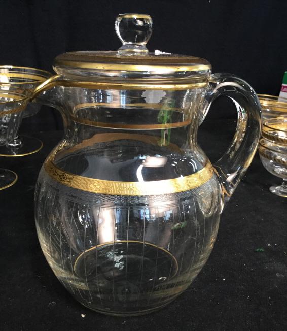 Gold rimmed Crystal pitcher: Gold rimmed Crystal pitcher, Table Top accessories, Bar Ware, drinks pitcher, tableware, service ware, pitcher. Measures approx 9 in tall by 7 in long by 6 in wide.