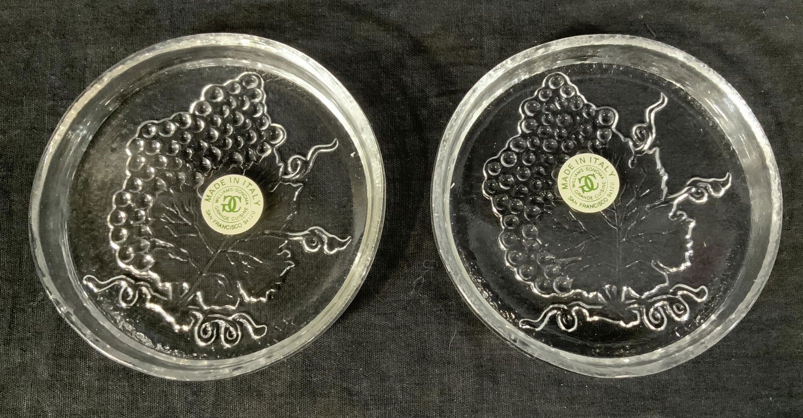 Pair WILLIAMS SONOMA Glass Coasters Italy: Pair WILLIAMS SONOMA Glass Coasters, Comes in original box, label to coasters reads ‘Made in Italy Williams Sonoma Grande Cuisine San Francisco 94120’, design features grapes, both measures 4 3/8