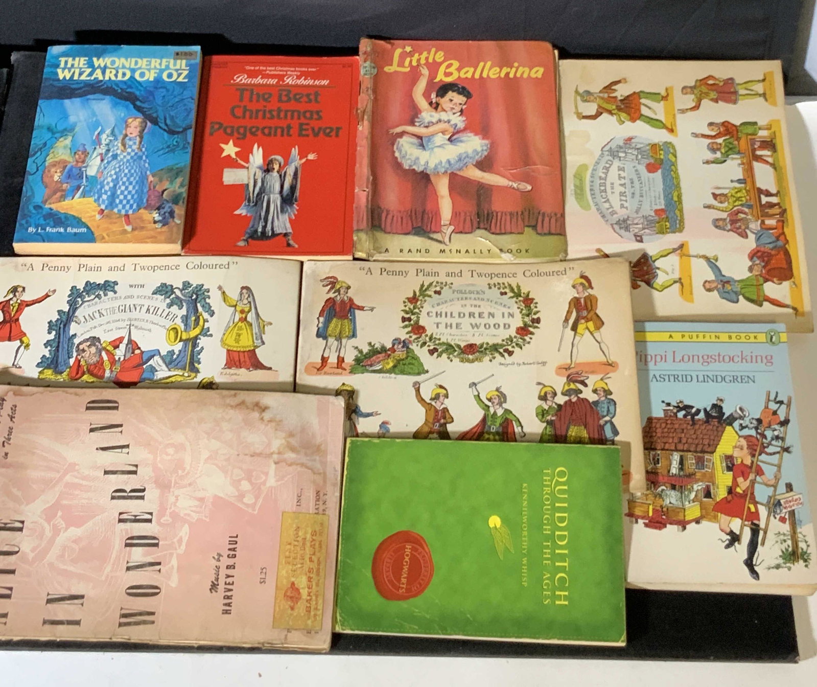 Lot 9 Antique & Vintage Children’s Books: 8 books and 1 playbook. Titles include: THE WONDERFUL WIZARD OF OZ, PIPPI LONGSTOCKING THE BEST CHRISTMAS PAGEANT EVER, & more. Playbook is ALICE IN WONDERLAND, includes sheet music. Antique condition
