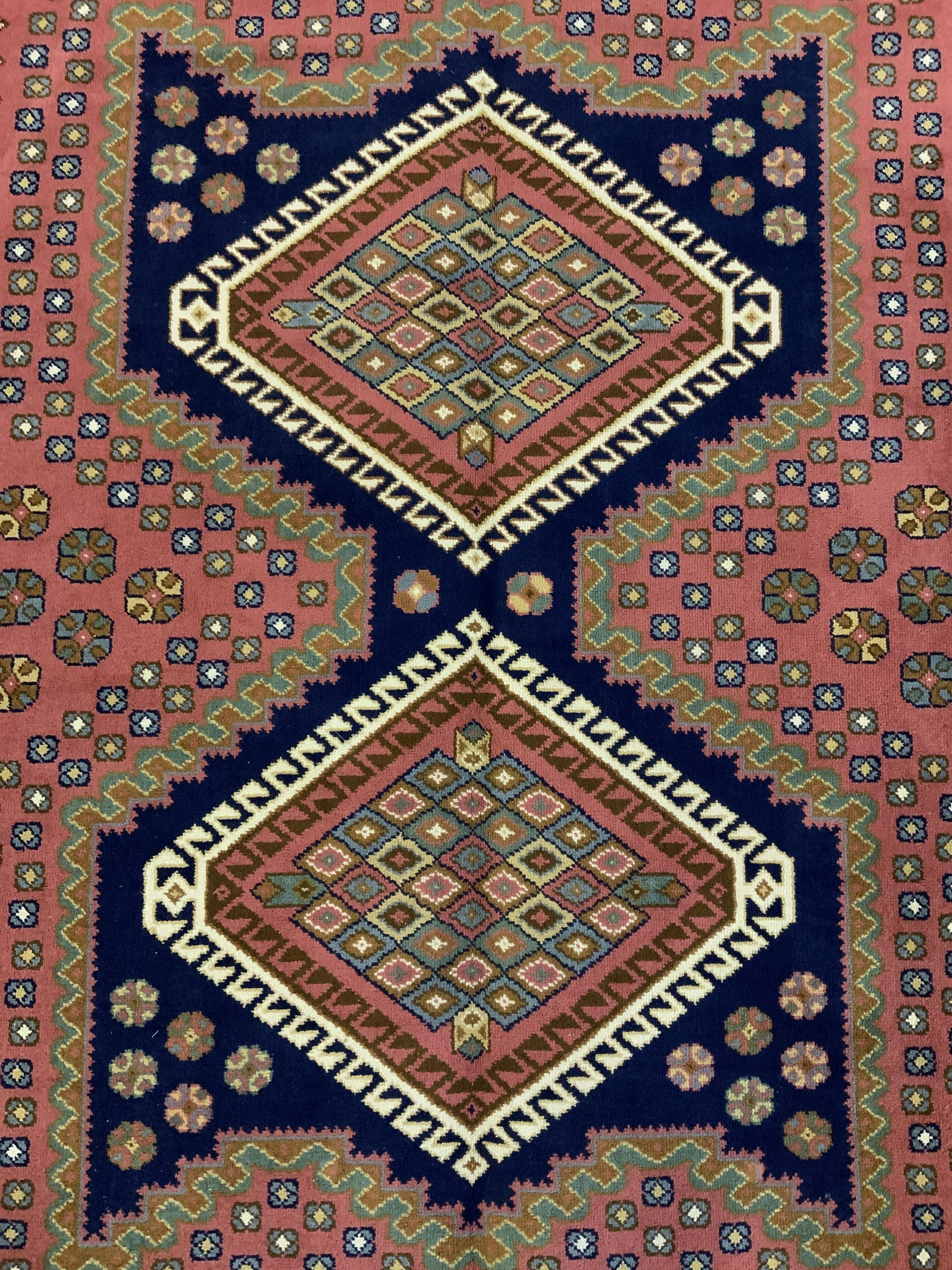 Vintage Room Sized Fringed Carpet: Vintage room sized area rug. Ends are fringed, decorated with multi toned floral and geometric patterns. Measures approx 141.5 inches long, 98.5 inches W. Wear is consistent with age and use. Carpets,