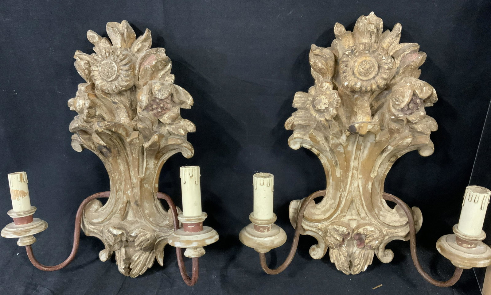 Pair Vintage Vegetal Carved Wood Wall Sconces: Vintage, possibly antique, hand carved wood wall sconces. Wood is hand painted, paint has worn away to a degree. Possibly French. Each socket resembles a melting candle. Measures approx 19 inches H, a