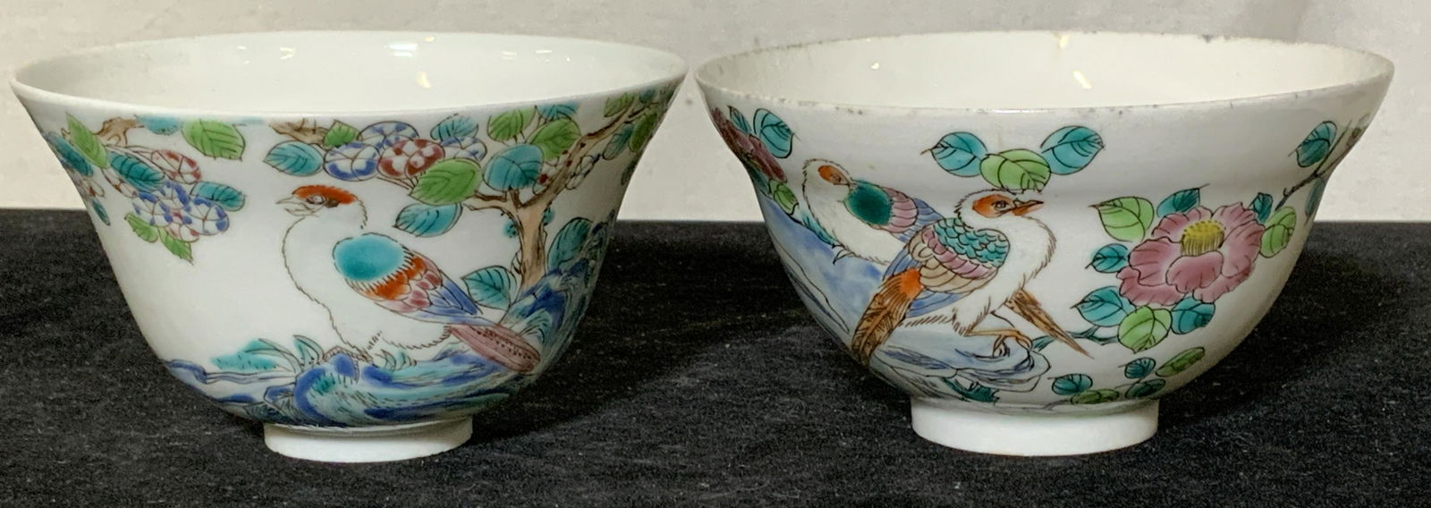 Pair Japanese Fine Bone Chine Tea Cups, Hallmarked: Hand painted paste up cherry blossoms and birds on fine bone translucent China. Traditional Japanese tea cups, Hallmarked with Japanese characters in red ink, hand written, over glaze. 3.5 in. diamete
