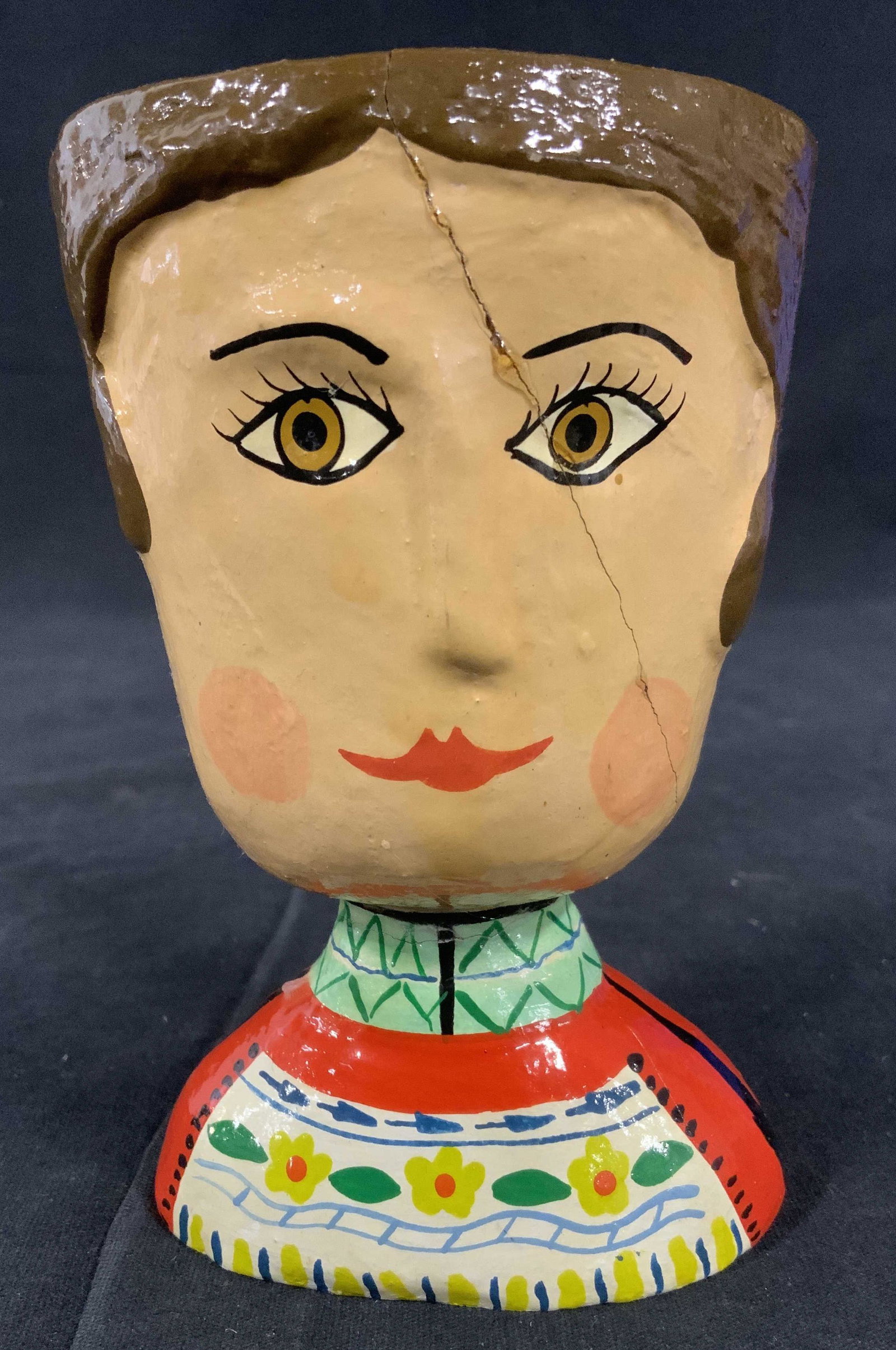 Hand Painted Double Faced Earthenware Cup: Hand painted earthenware cup, possibly clay. Each side of the cup is sculpted and painted to resemble a face, cups are glazed. Clothing detail has been painted onto the figure as well. Measures approx
