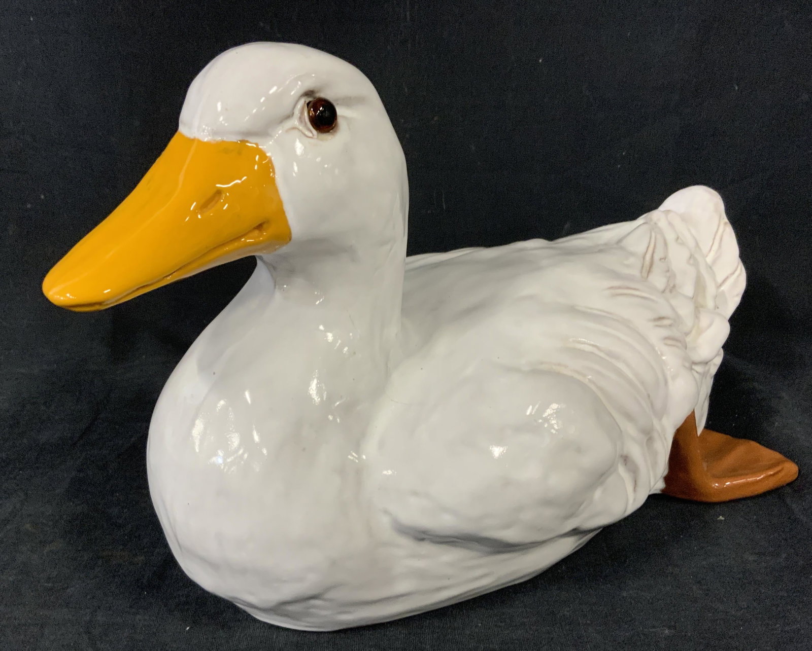 Glazed Earthenware Goose Figural: Glazed earthenware sculpture, possibly vintage, resembles a goose. Measures approx 7.5 inches H, and 13.5 inches long. Wear is consistent with age, some crazing and cracking present. Geese, waterfowl,