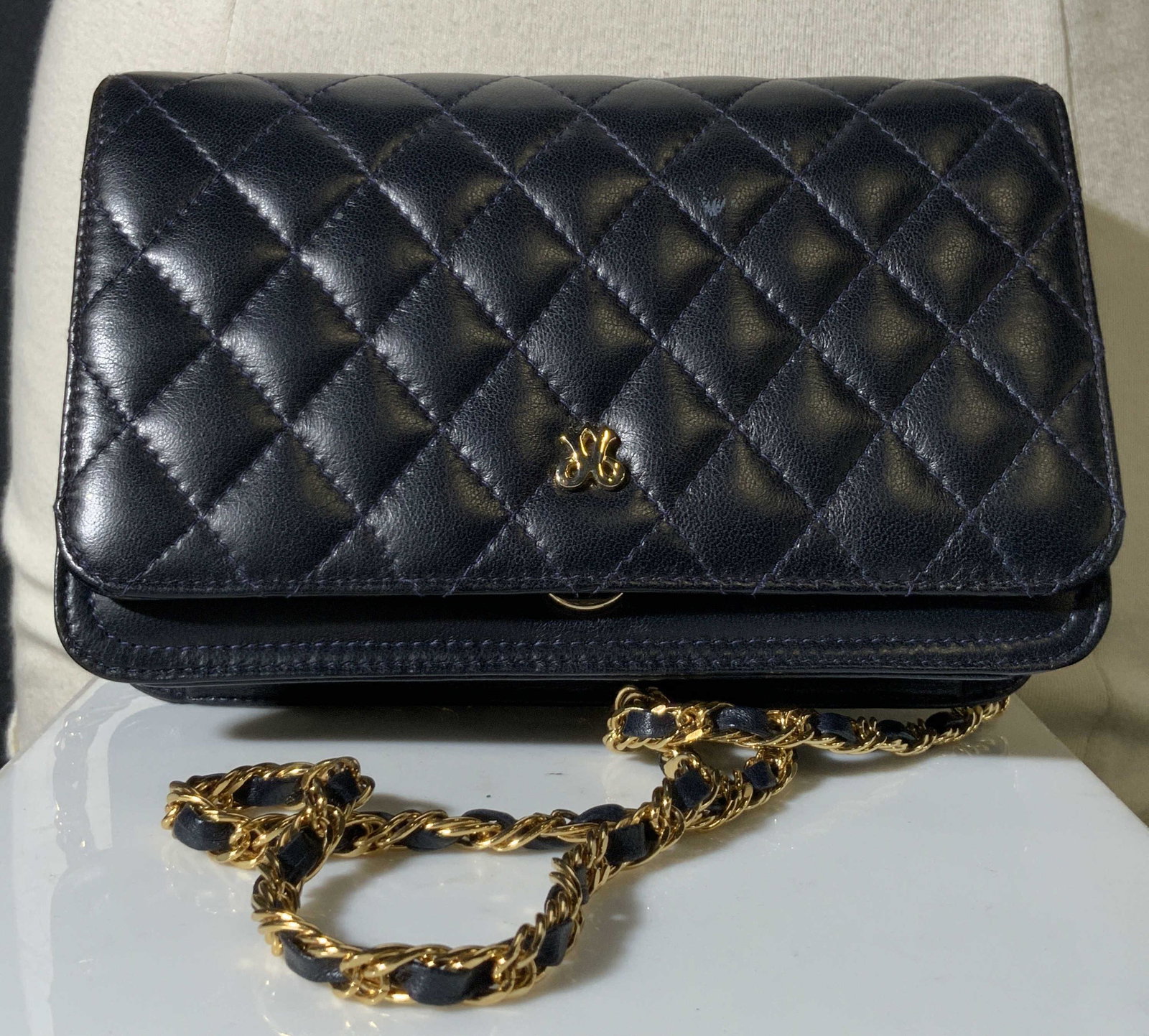 Jay Herbert Quilted Black Shoulder Bag: Black shoulder bag with metal gold toned accents braided into shoulder strap. Quilted design. Interior lined w/ textile. One pocket. Snap button closure. Sewn in tag reads: Jay Herbert. New York. Appr