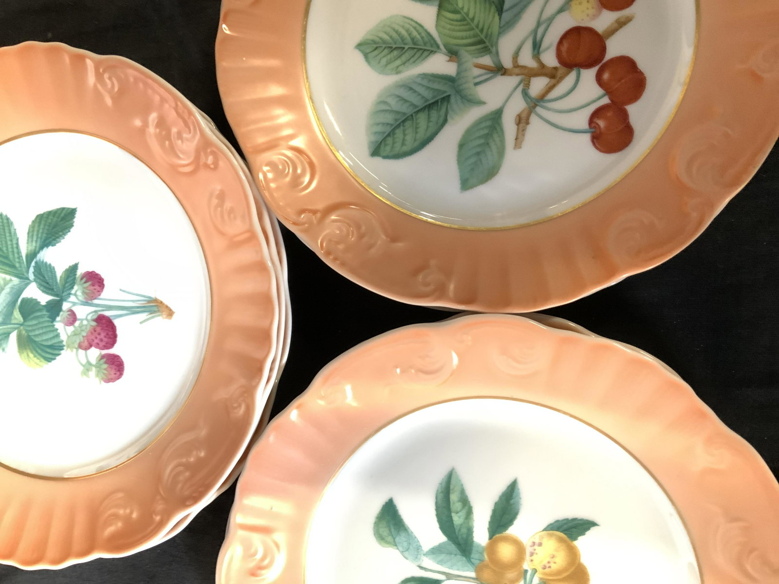 Set 11 MOTTAHEDEH Vista Alegre Summer Fruit Plates: Luxury Portuguese Brand Vista Alegre Mottahedeh ceramic salad plates in the Summer Fruit pattern, 8 in. diameter. Each plate has a different fruit in the center. Peach/ coral border. Hallmarked on ver