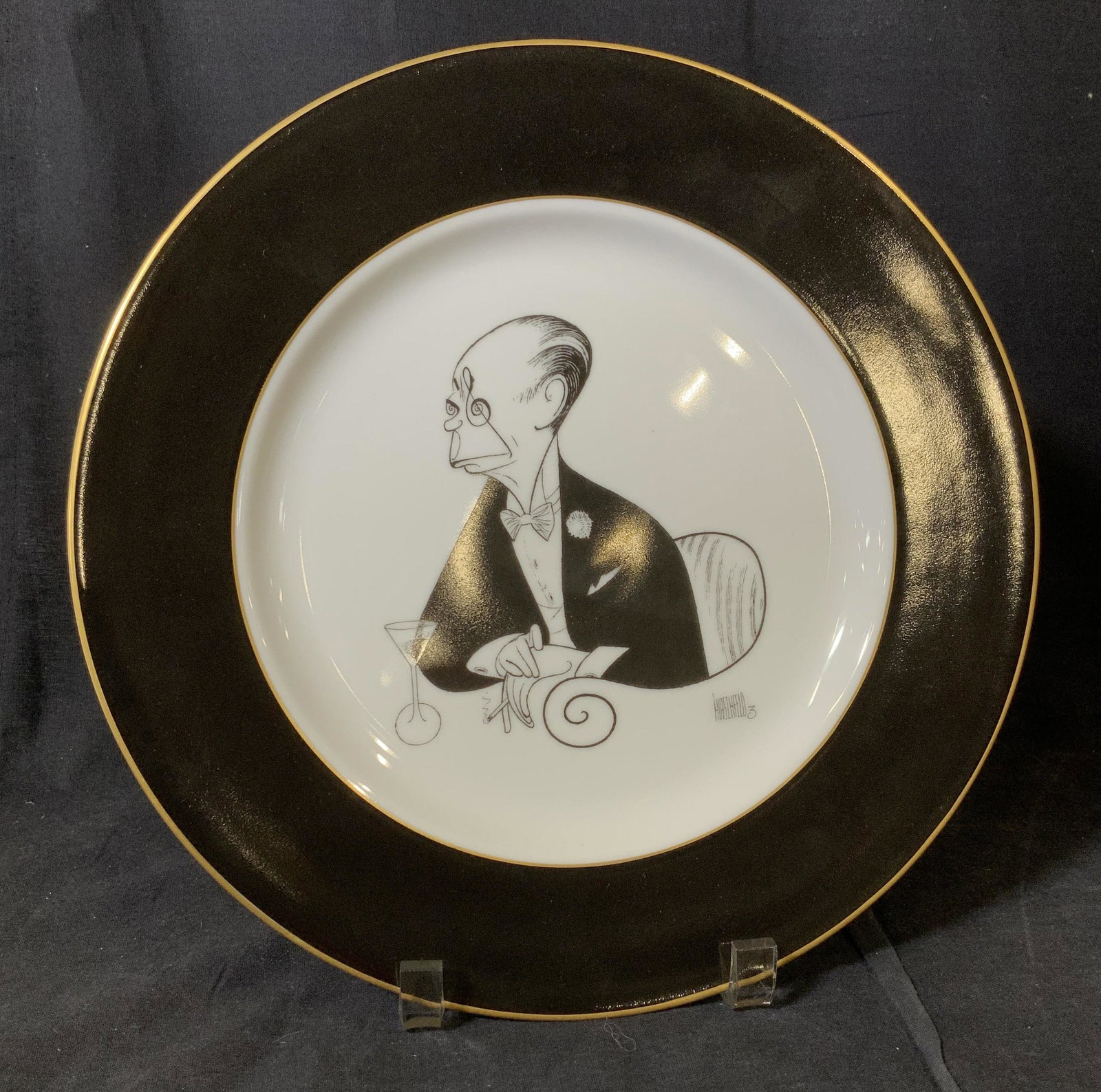 AL HIRSHFIELD Cartoonist Specialty Porcelain Plate: Al Hirschfeld (1903–2003) was a master of drawing caricatures for the Sunday NT TIMES & BROADWAY acts while in the audience himself! He absorbed his environment of its age while growing up in the ti