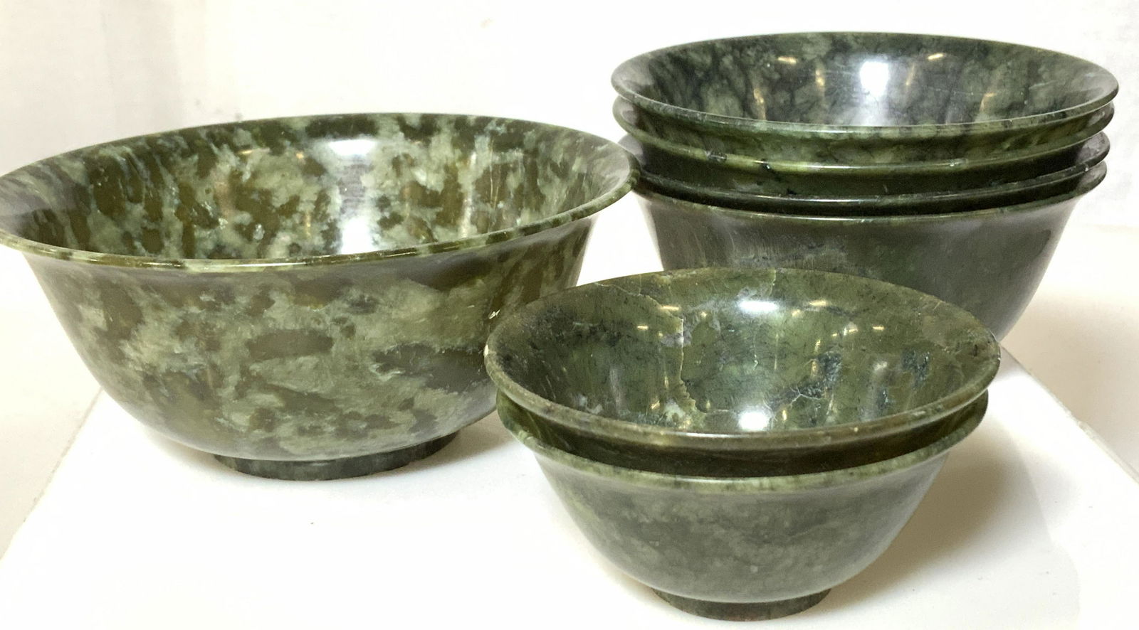 Group 7 Collectible Vintage Carved Jade Bowls: Translucent jade, some lighter weight than others, different sizes, can be used for tea cups, spice bowls, trinket bowls, home decor, Rice bowls, more. Largest bowl measures 5 x 2 in. Smaller bowls me