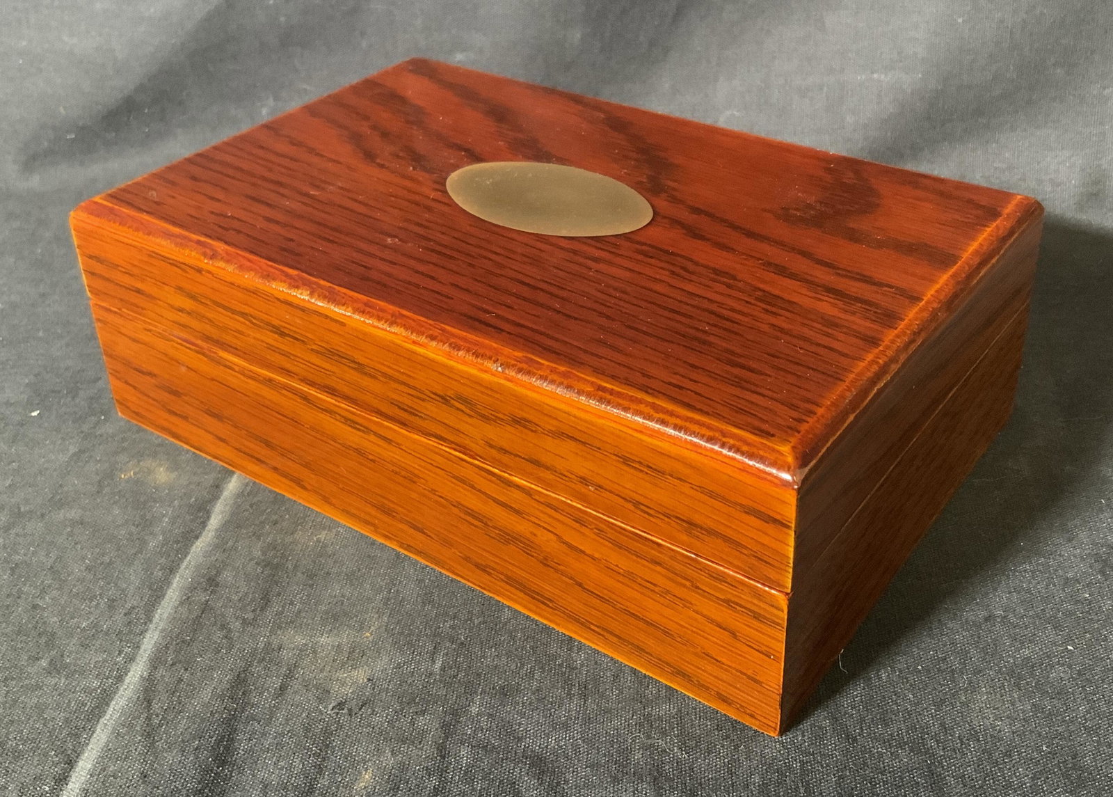 Vintage Rosewood Card Box, KOREA: Vintage card box, crafted from rosewood. A brass inlay decorates the lid. Label on underside reads a MADE IN KOREA. Interior is lined with fabric, and separated into two compartments. Lid hinges are b