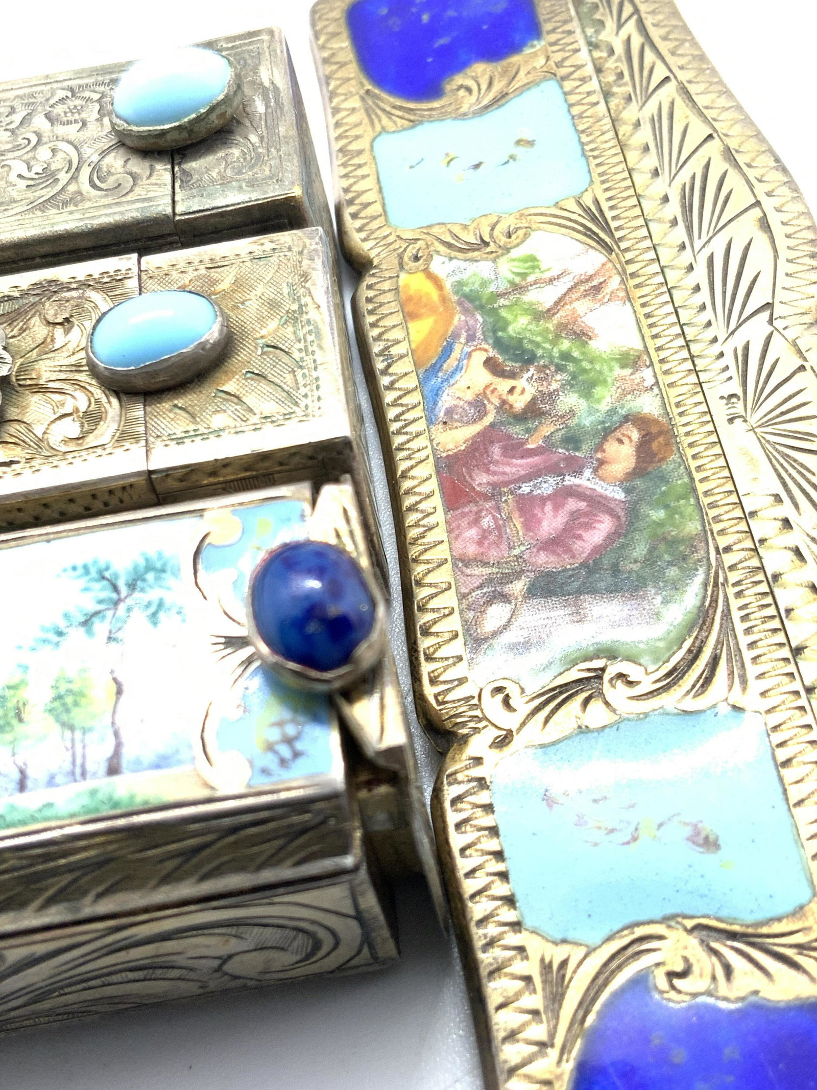 Lot4 Antique Enameled Silver Lipstick Cases & Comb: Four pieces of antique, possibly vintage, silver lipstick holders and a comb case. The comb case is marked 800 and has a gold wash over the silver. Finely etched detailing throughout along with enamel