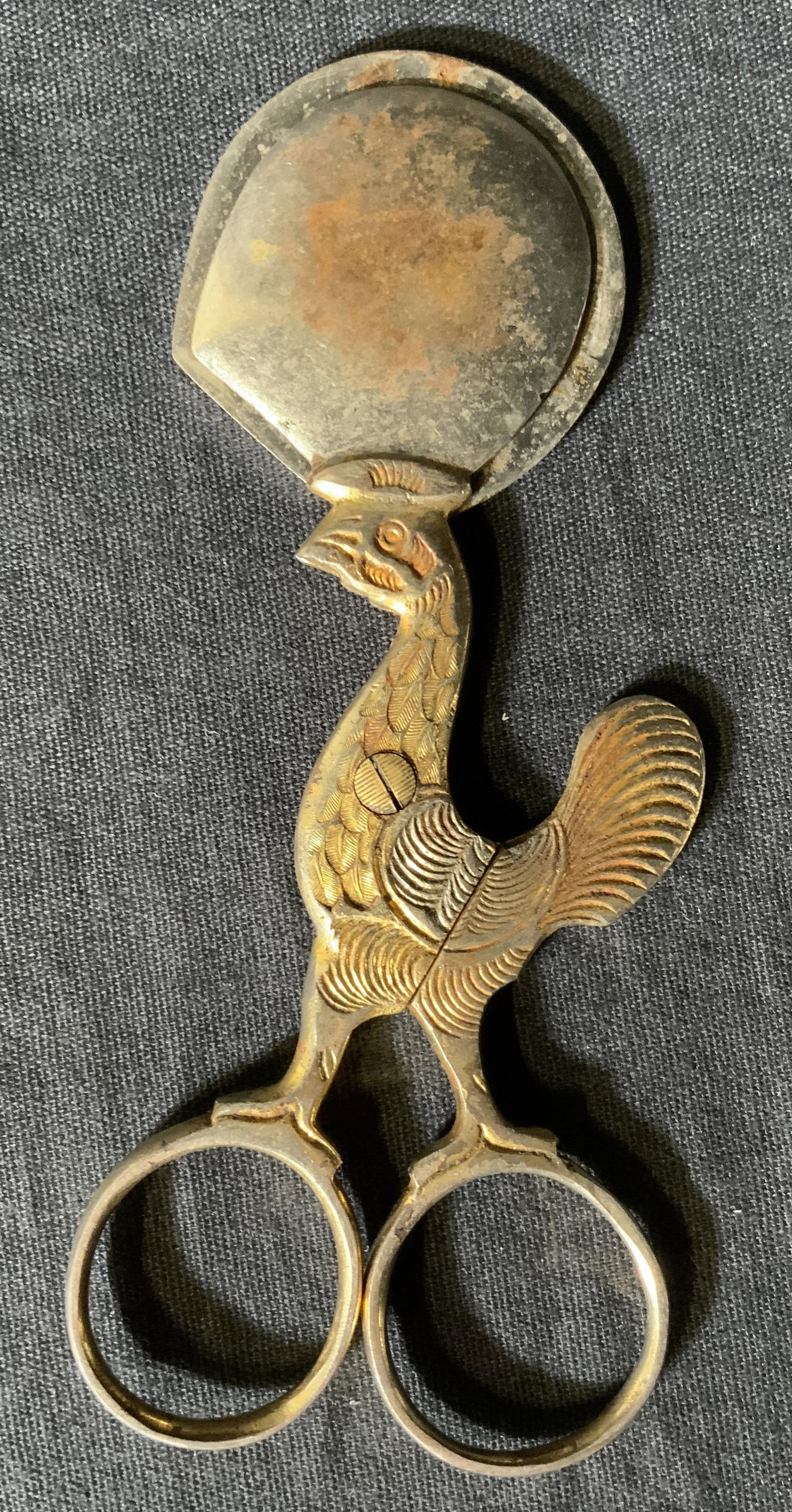 Antique Metal Rooster Cutter Accessory: Antique Metal Rooster figural cutter, possibly cigar cutter or boiled egg cutter. no apparent inscriptions or marks, measures 5 inches long x 2 1/8 inches at widest point, rusting and loss of gold ton